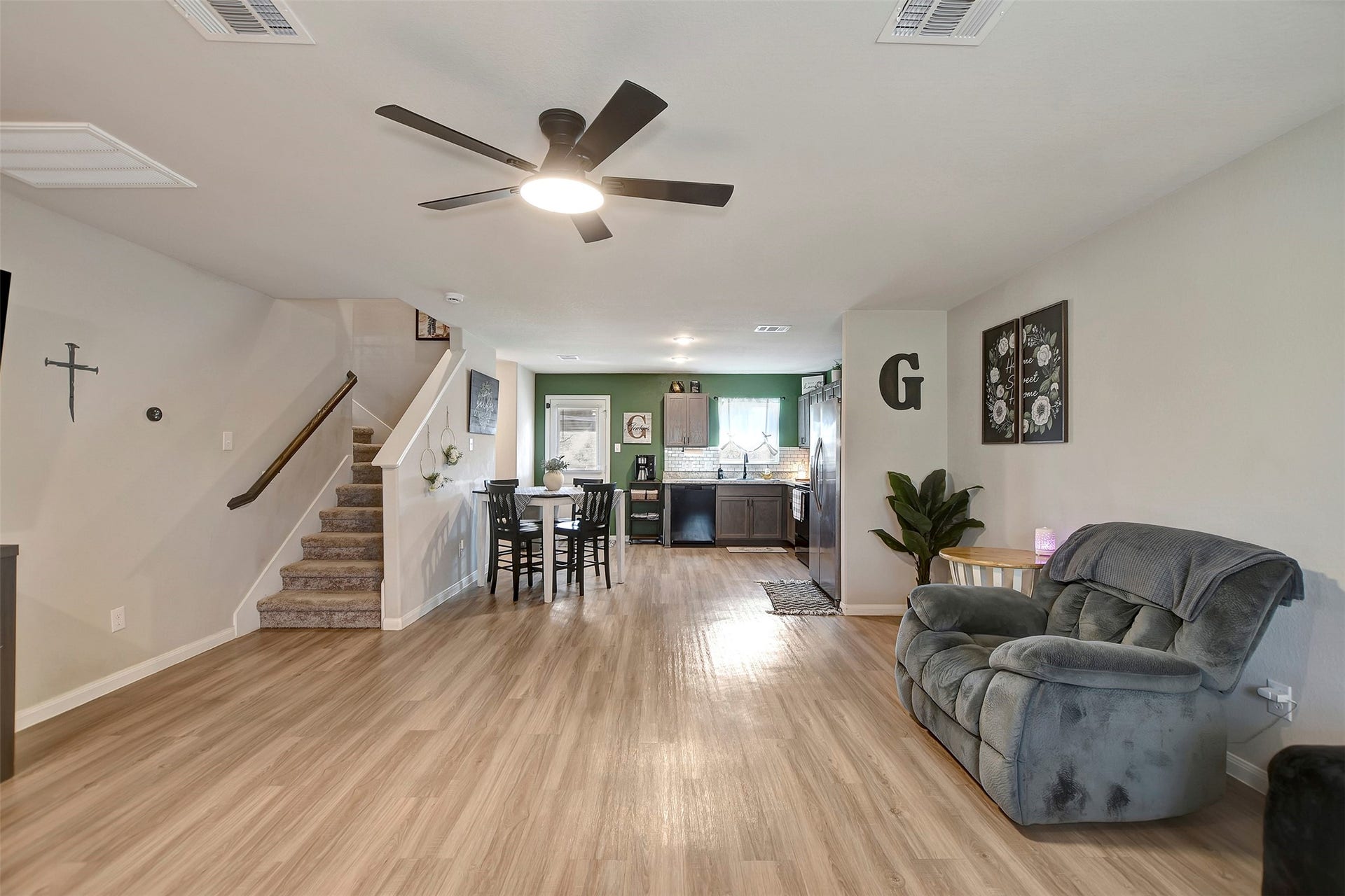 View from living room with stairs leading to your loft and 3 bedrooms!