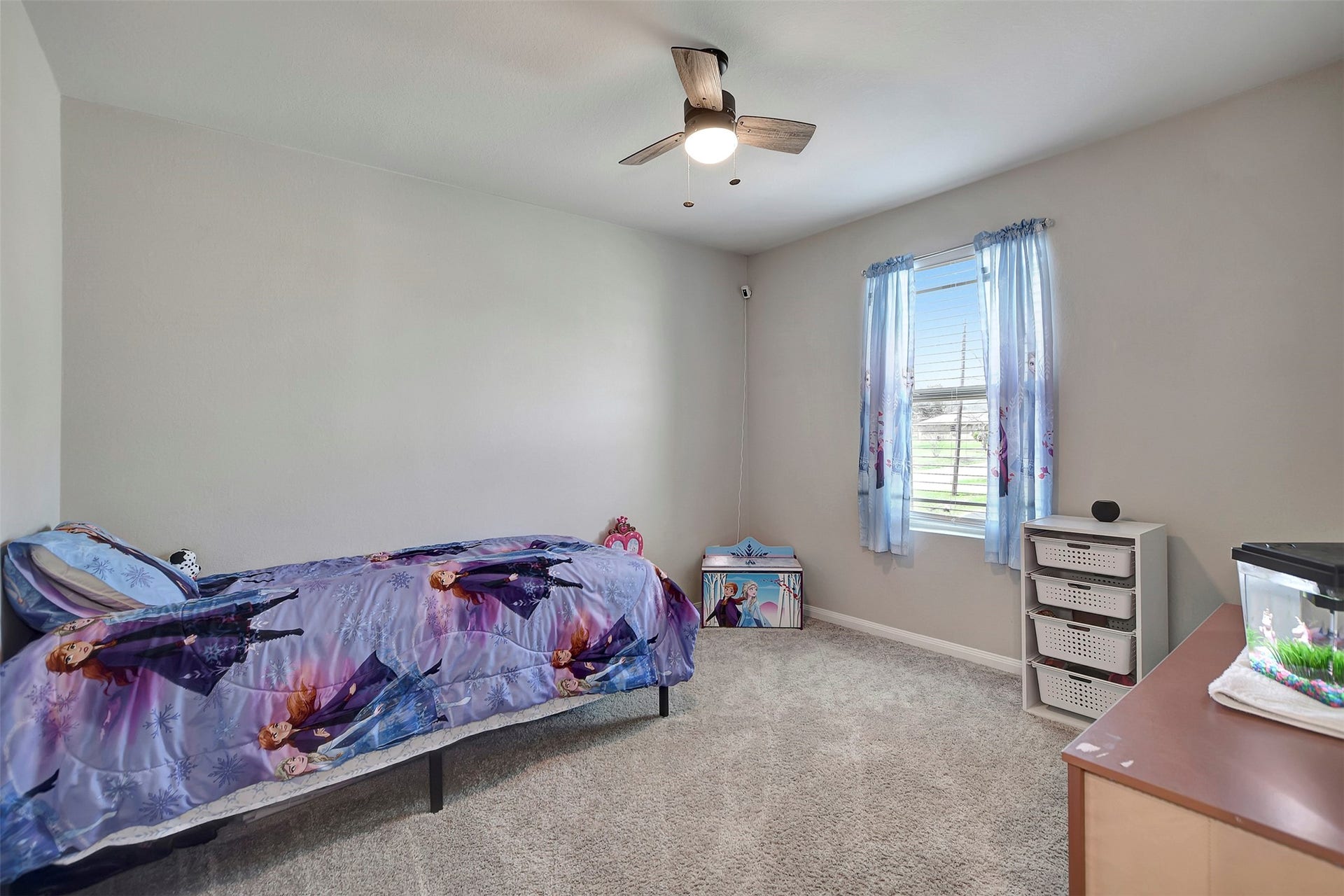 Comfortable secondary bedroom with ample natural light and closet space.