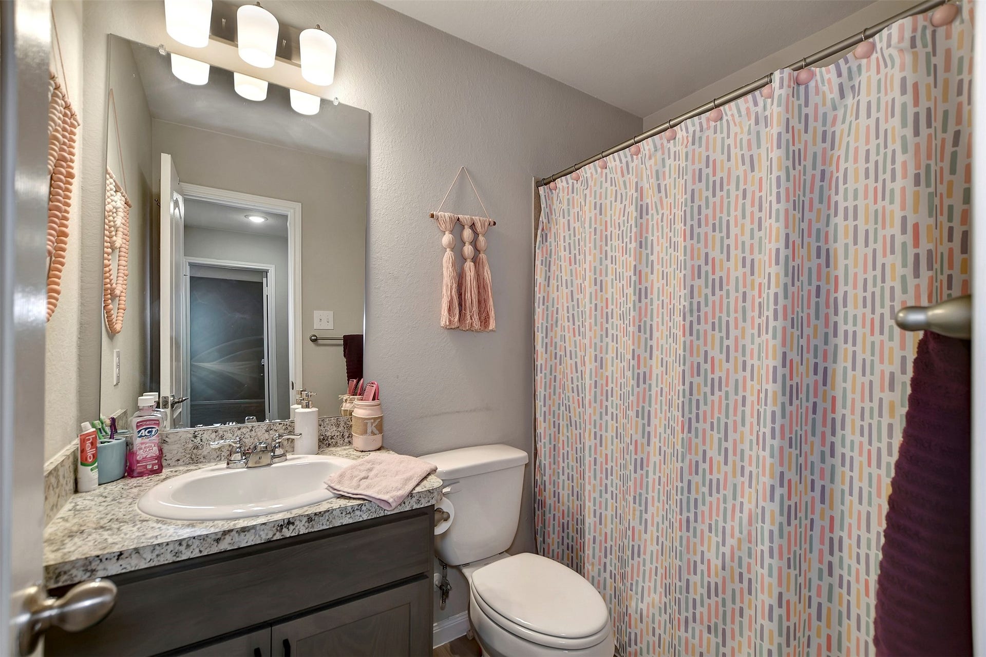 Full upstairs bathroom conveniently located near secondary bedrooms.