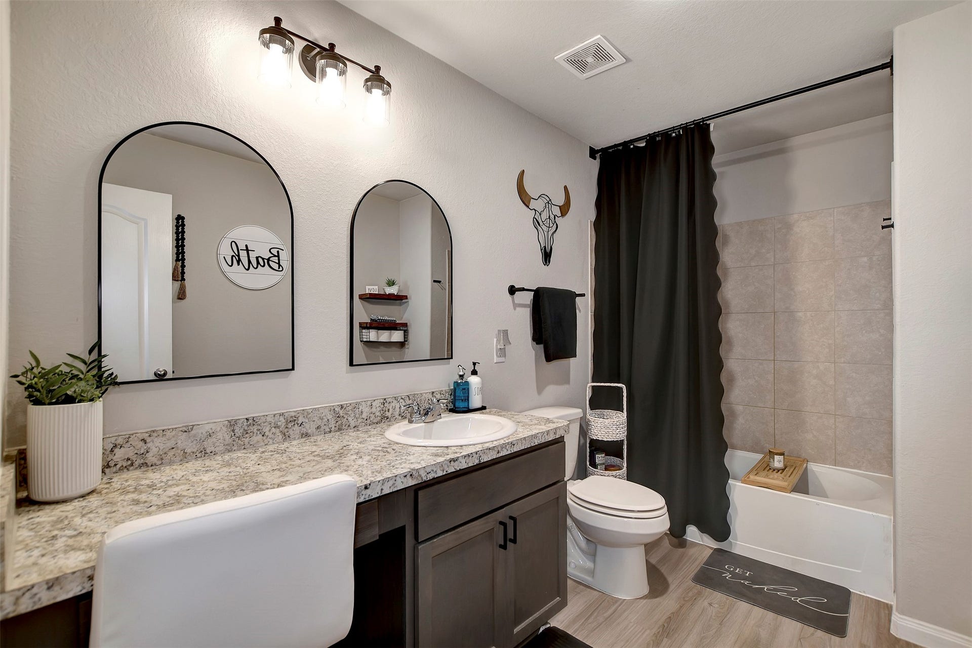 Well-appointed primary bath with modern finishes and functional layout.