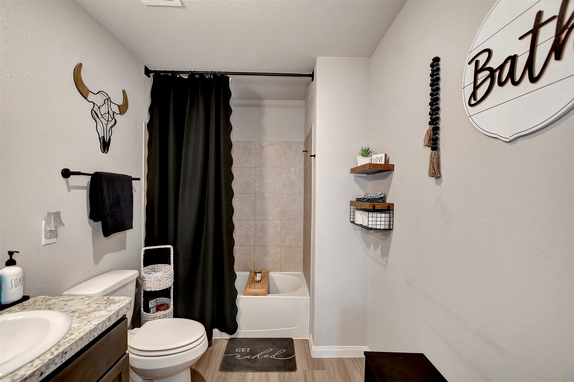 Well-appointed primary bath with modern finishes and functional layout.