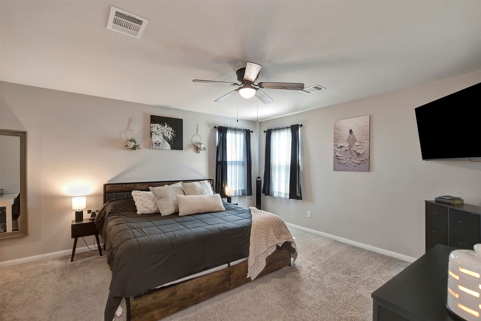 Spacious primary suite located upstairs, offering privacy and comfort.