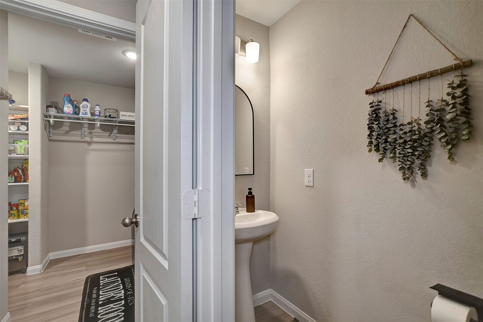 Half bath, conveniently located off of the kitchen.