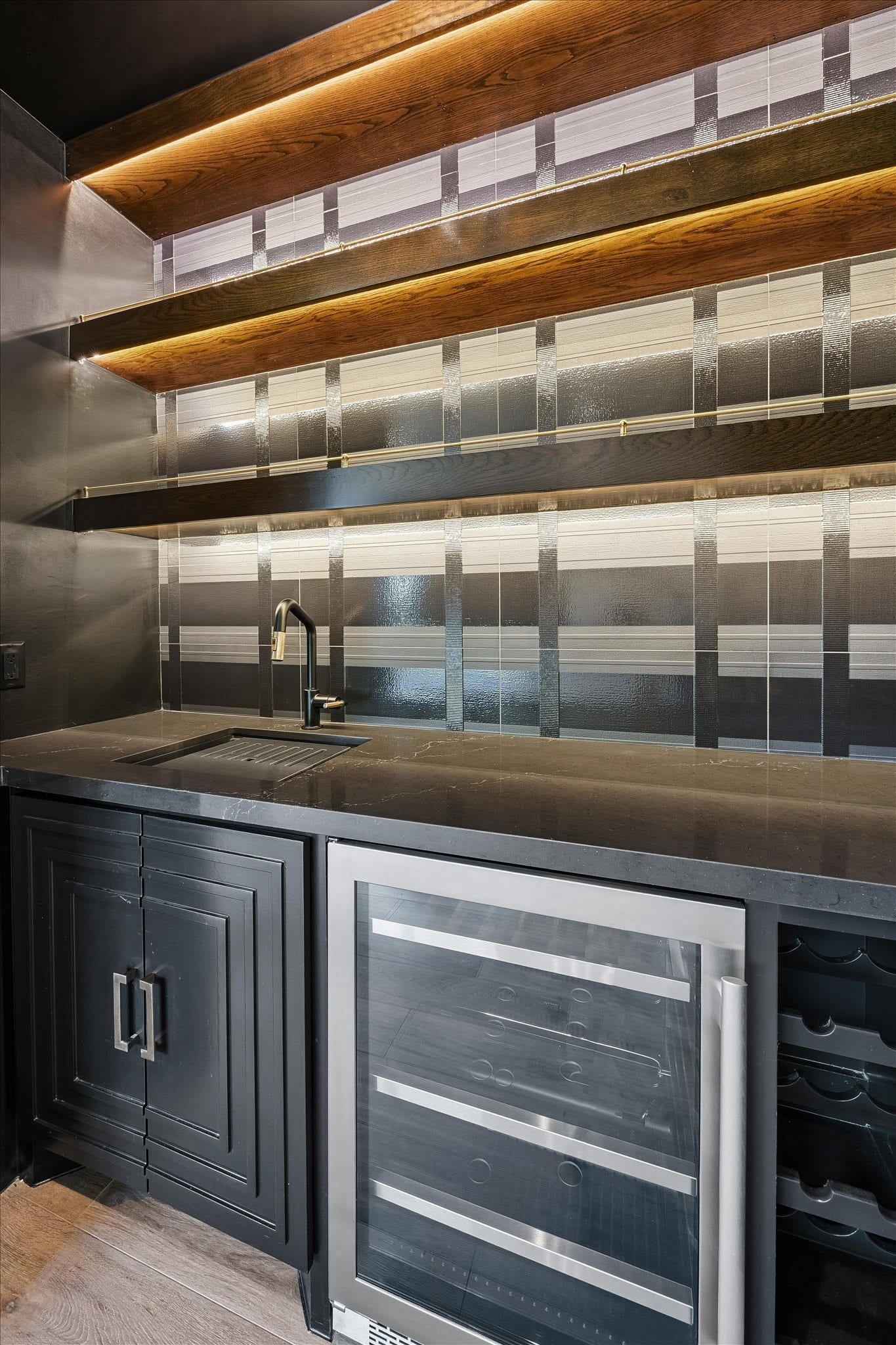 65 Shadow Creek Ridge Drive, Spring, TX 77389 Custom built-in cabinetry, generous counter space, and open shelving keep glassware and essentials beautifully organized, while under-shelf lighting sets the mood.