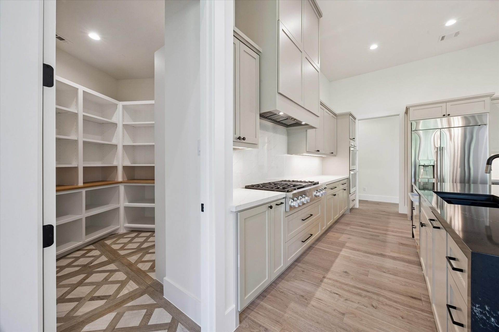 65 Shadow Creek Ridge Drive, Spring, TX 77389 Just off the main workspace, a walk-in pantry delivers impressive built-in shelving and countertop space, so bulk buys and small appliances can finally stop playing hide-and-seek.
