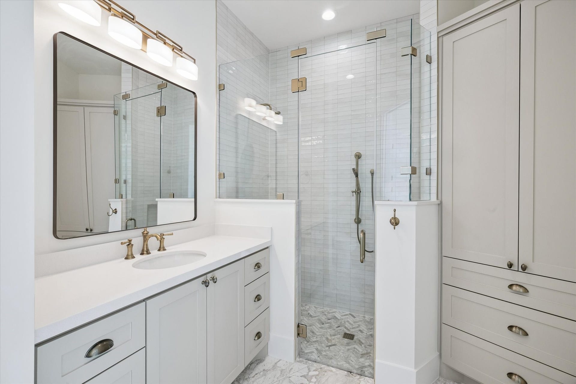 65 Shadow Creek Ridge Drive, Spring, TX 77389 Spa-inspired bathroom with quartz vanity, oversized glass shower, and sleek lighting for a polished finish.