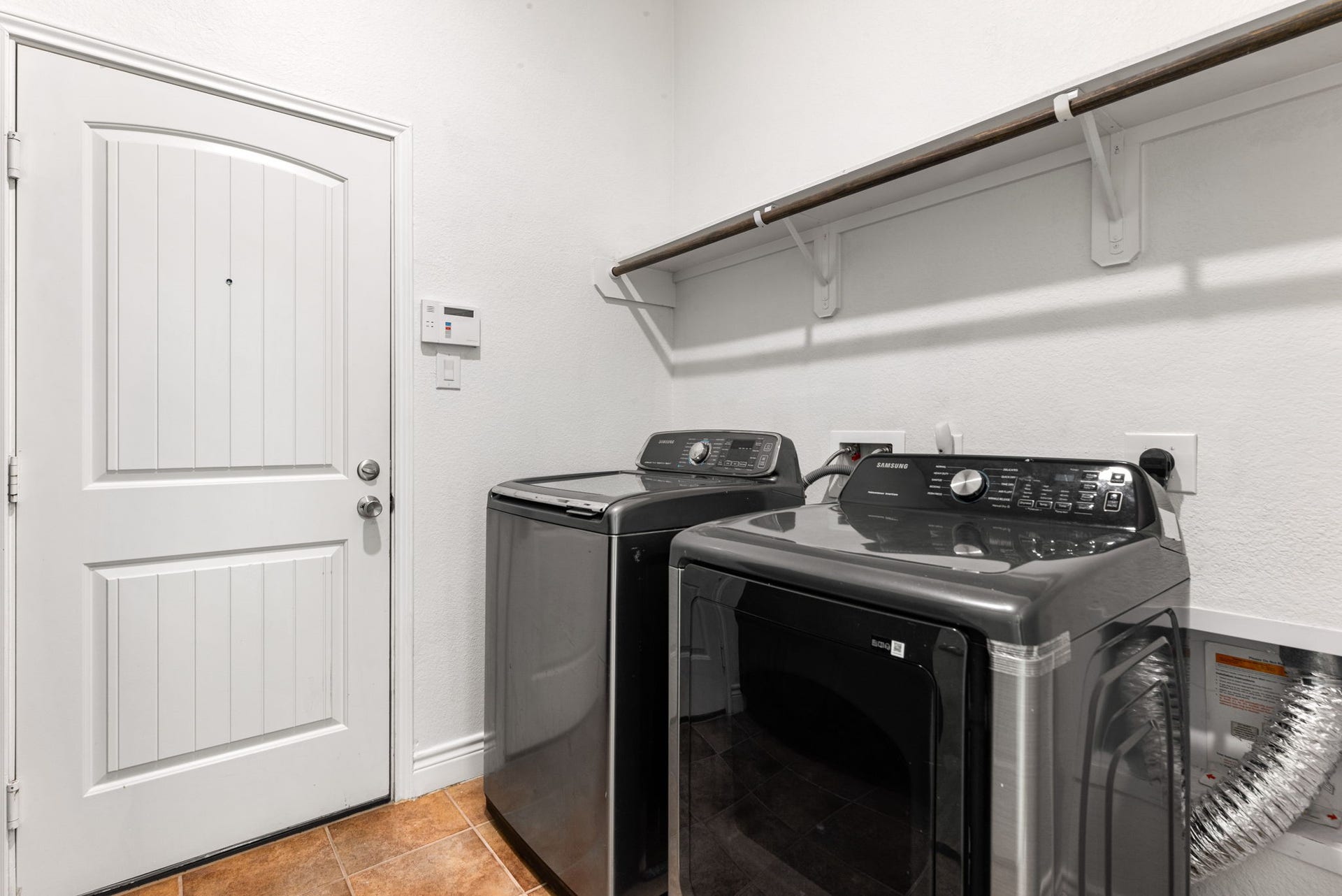3318 Elizabeth Springs Court, Katy, TX 77494 Convenient upstairs utility room with washer and dryer included.
