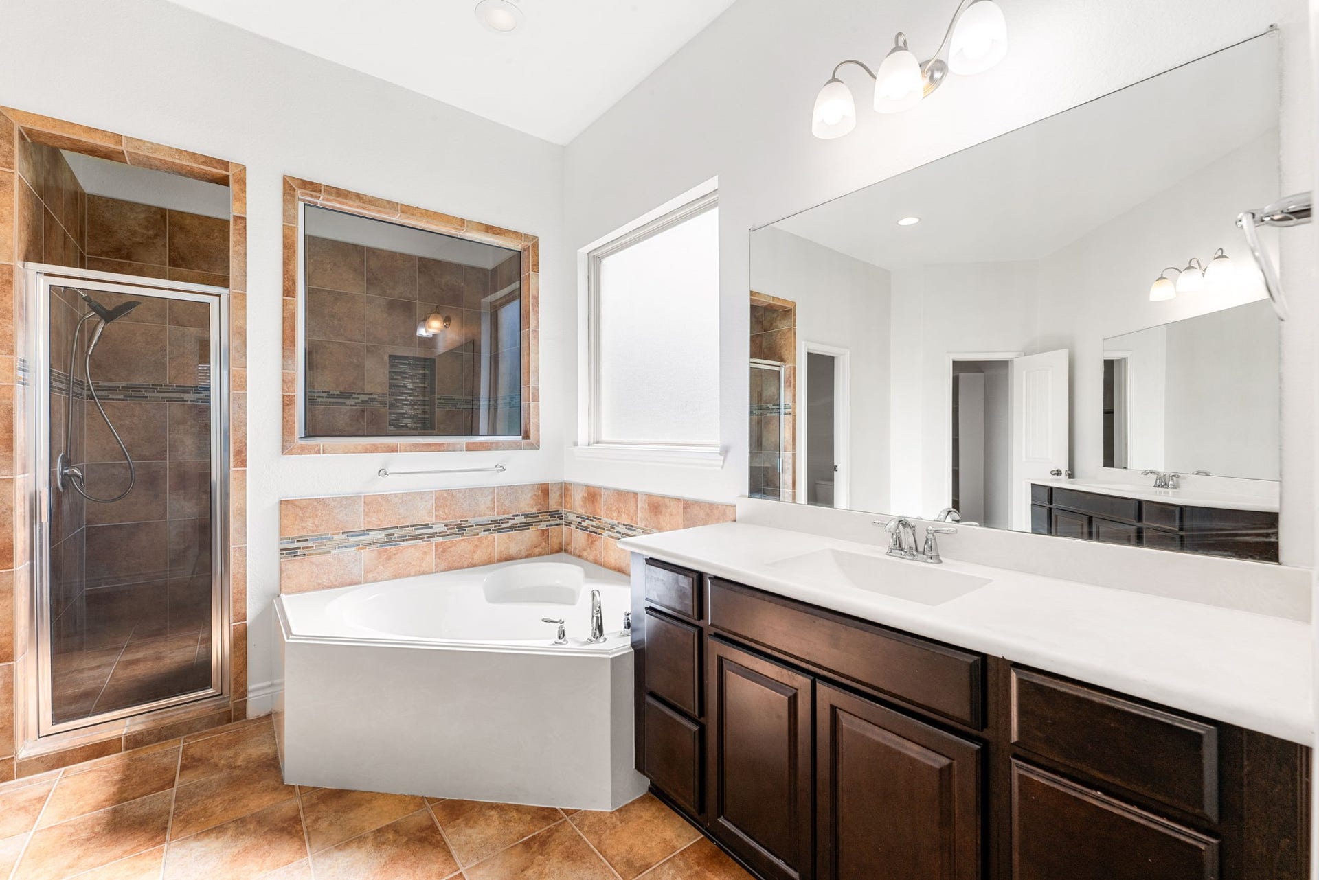 3318 Elizabeth Springs Court, Katy, TX 77494 Primary bathroom features walk-in shower, soaking tub, and double vanities.
