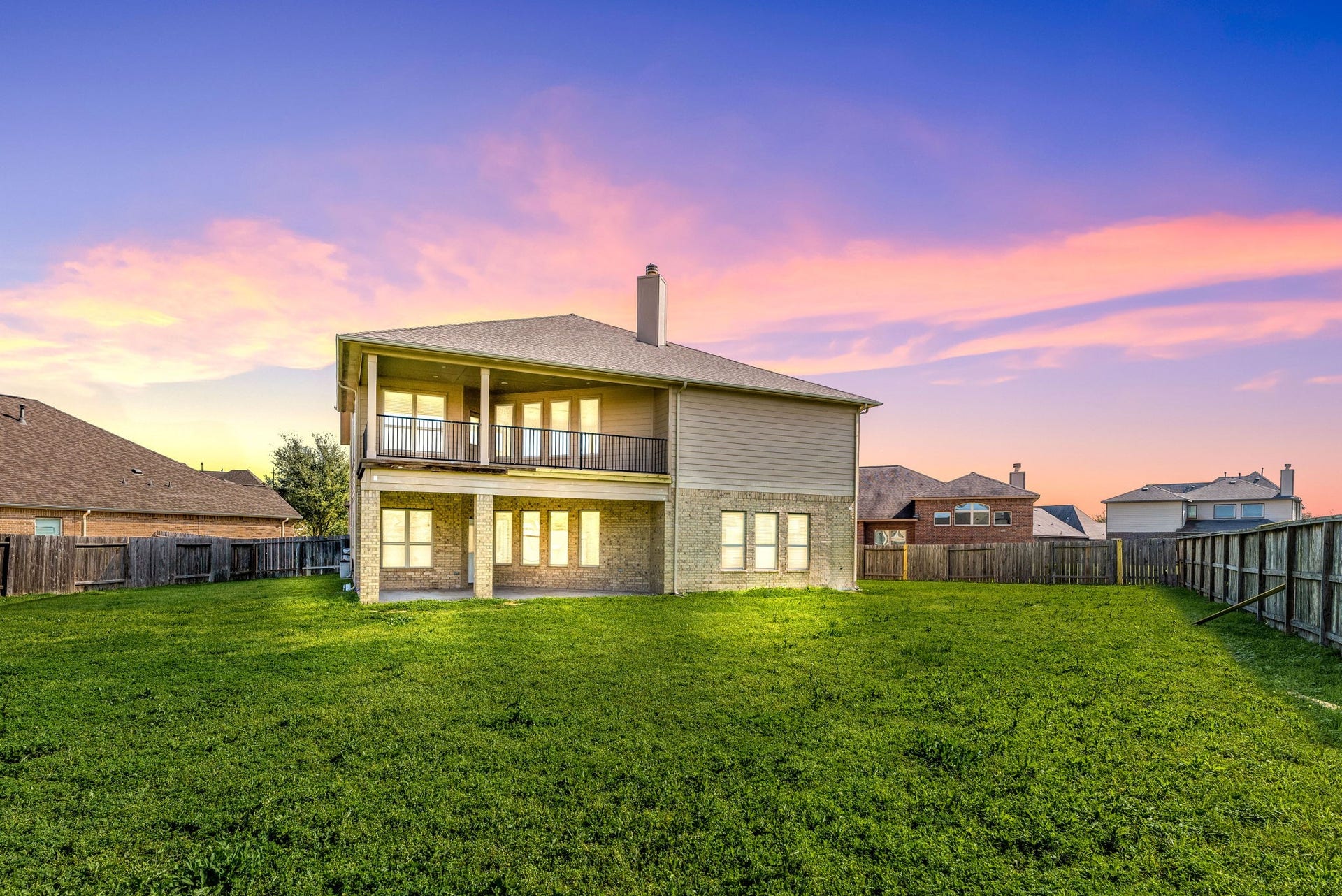 3318 Elizabeth Springs Court, Katy, TX 77494 Beautiful twilight view highlights the home's impressive rear elevation and oversized backyard.