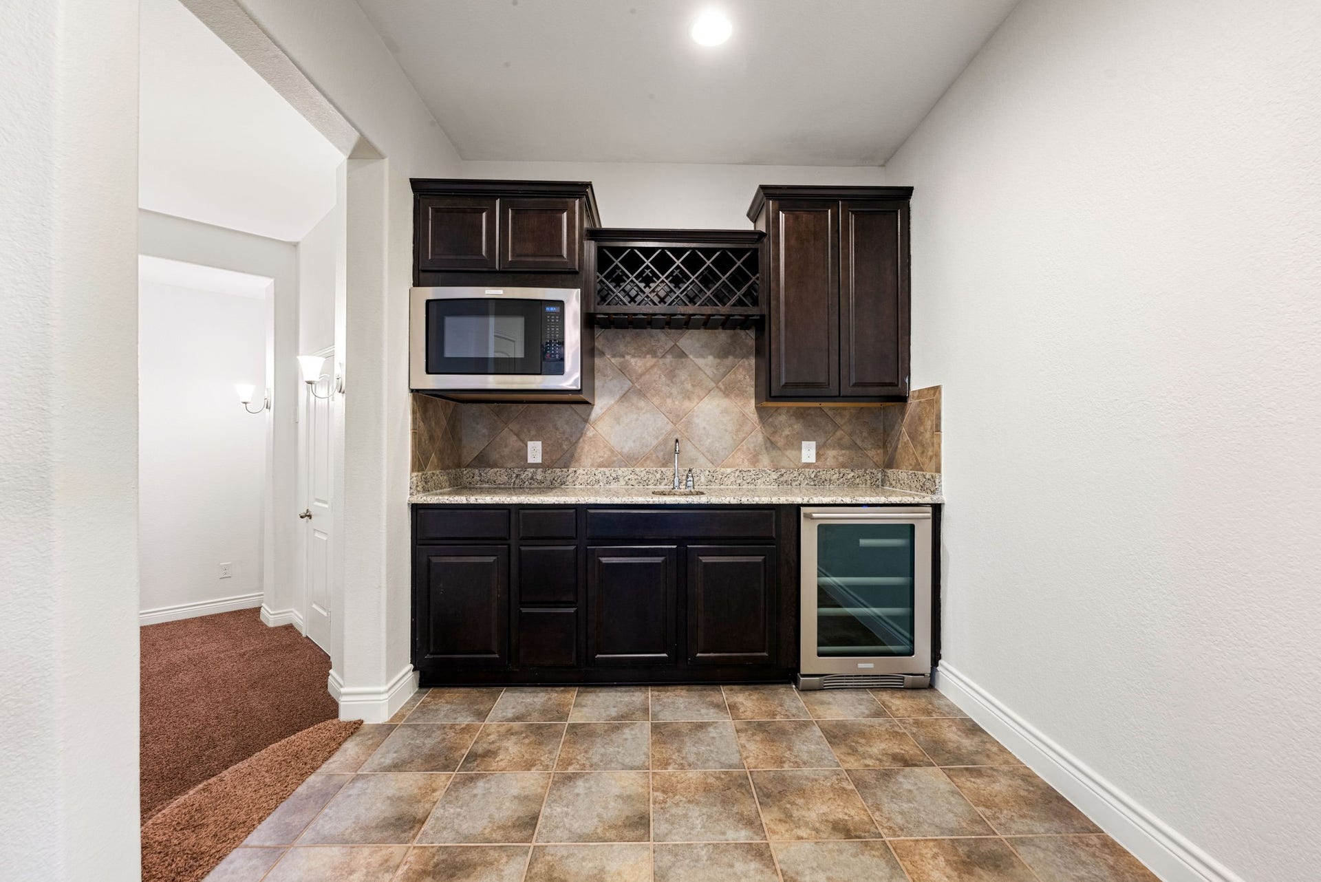 3318 Elizabeth Springs Court, Katy, TX 77494 Convenient upstairs refreshment center steps down to media room.