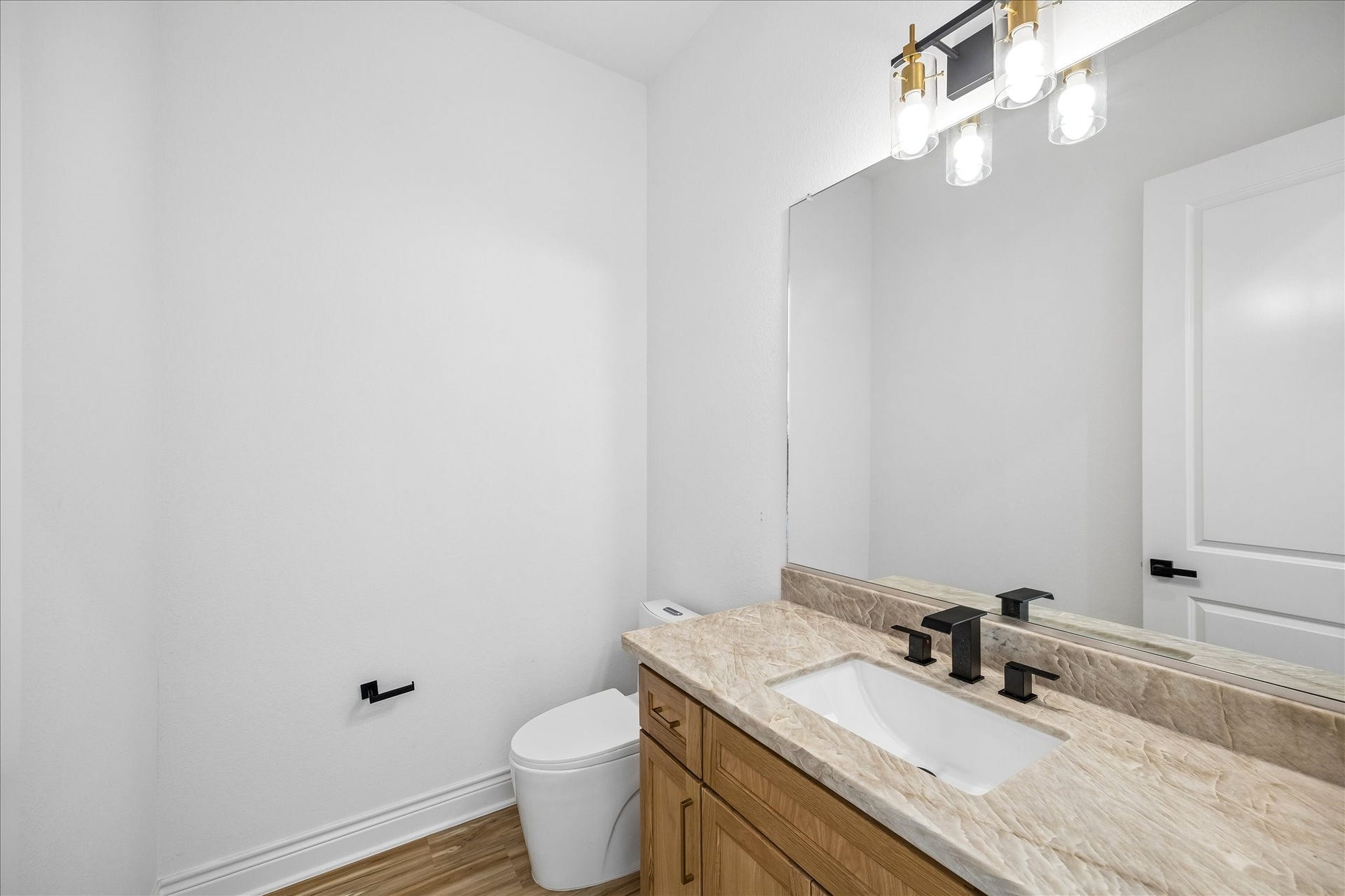 Stylish powder room featuring modern finishes and thoughtful details.