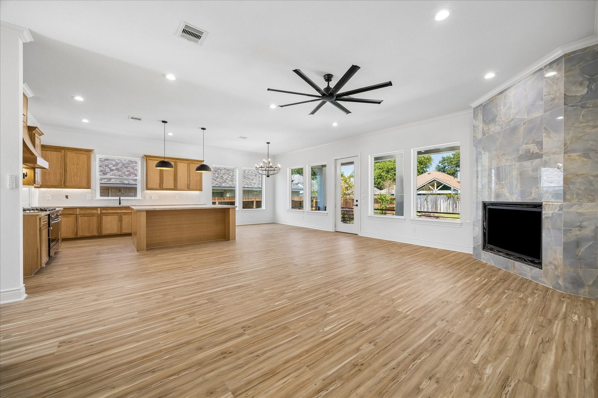 Spacious kitchen island features a convenient overhang with room for bar stools.