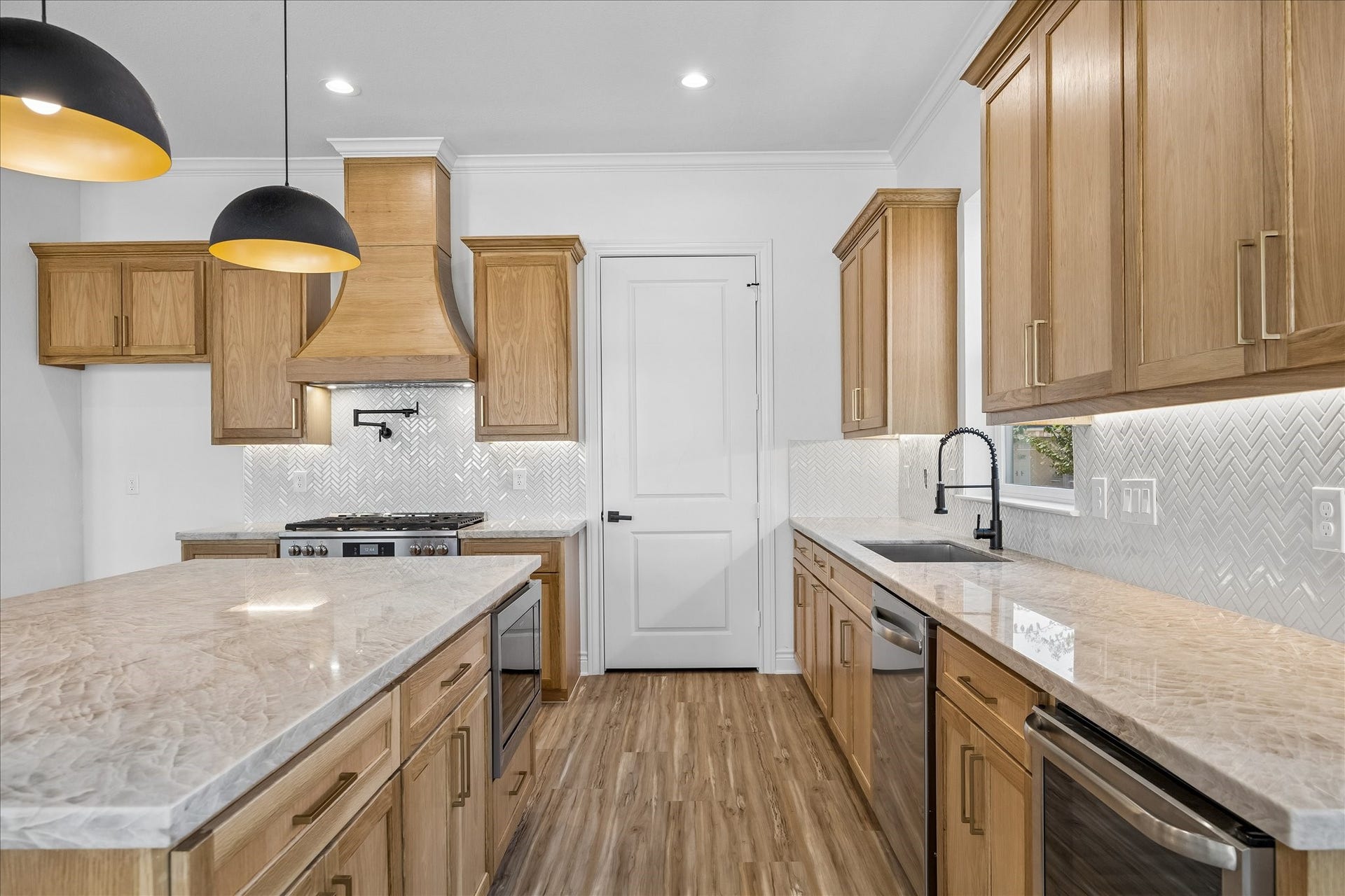 Beautiful Taj Mahal quartzite countertops featured on the kitchen island.