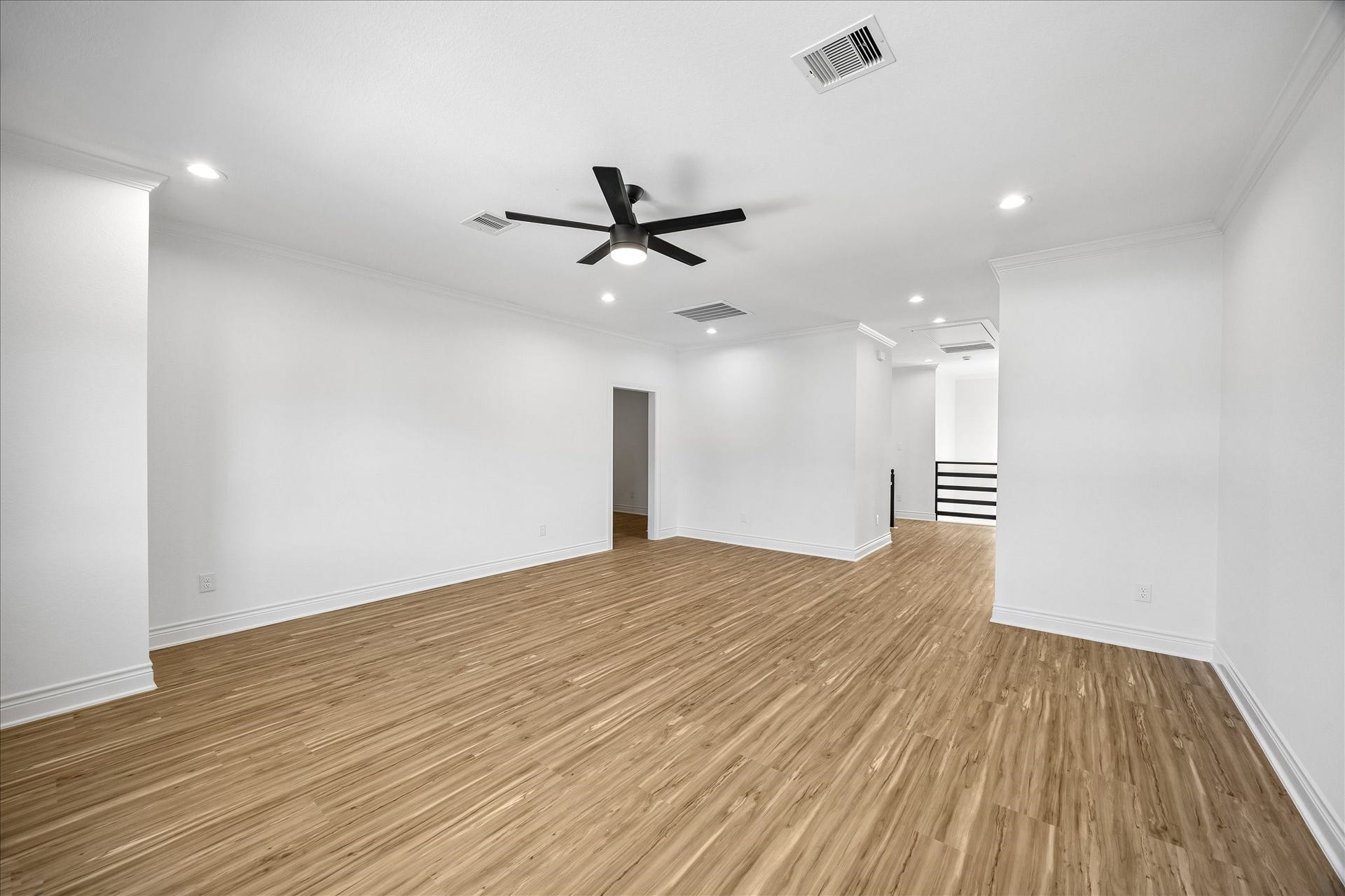 Another view of the spacious upstairs game room, with convenient access to the separate media room to the left.