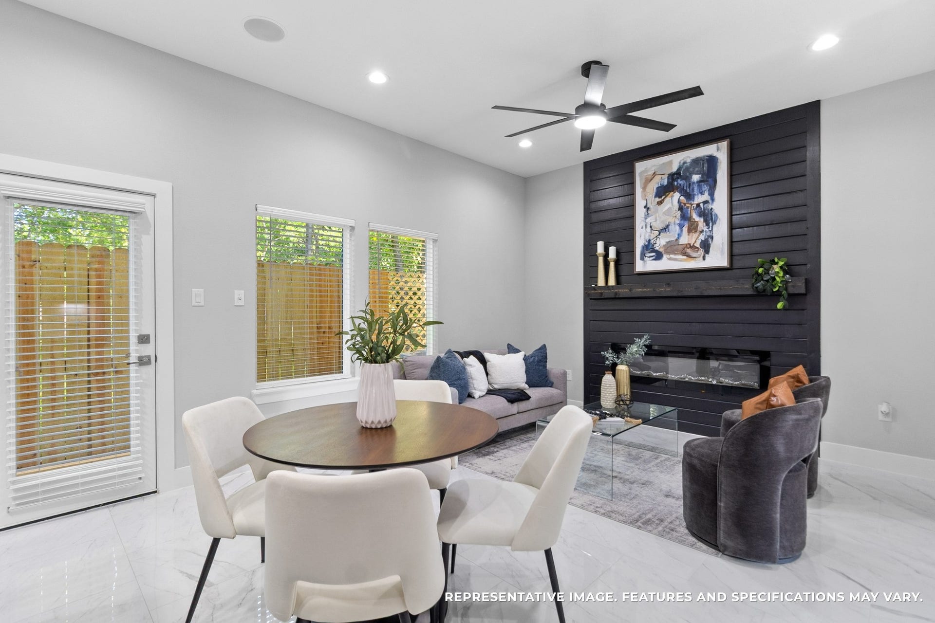 825 Paul Quinn Street, #B, Houston, TX 77091 From your dining area, you love the way the fireplace wall anchors the roomevery meal feels cozy with that modern focal point nearby.