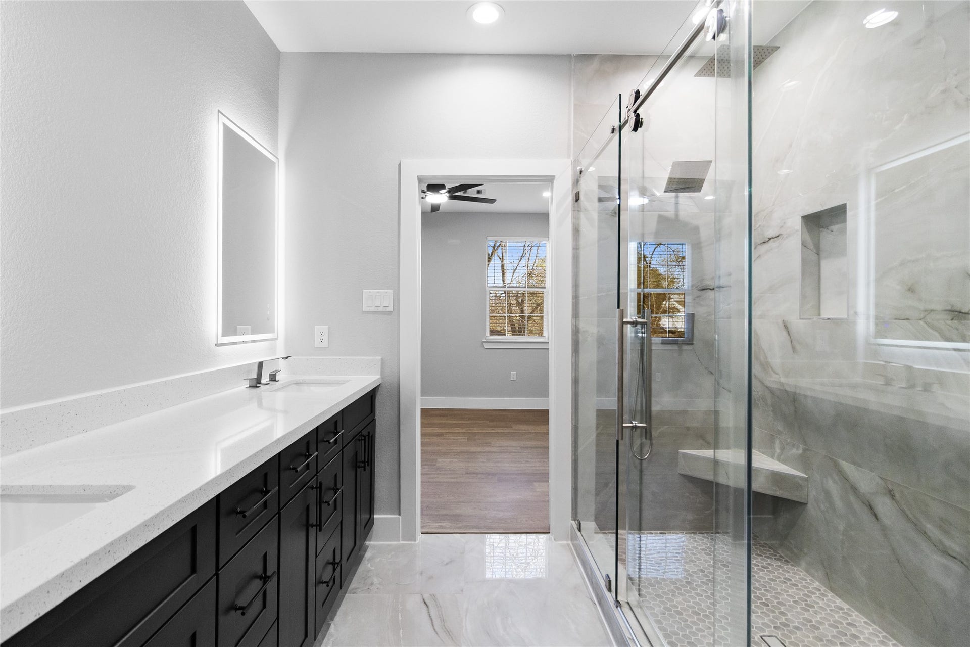 825 Paul Quinn Street, #B, Houston, TX 77091 The walk-in shower, framed in glass and marble-style tile, gives you a daily dose of luxury while leading straight into your roomy closet.