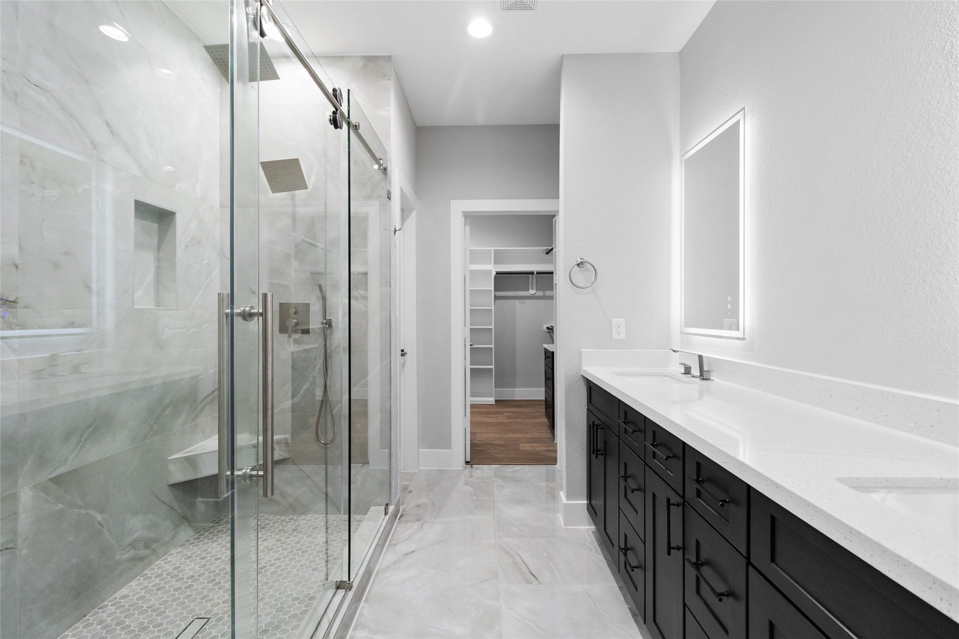 825 Paul Quinn Street, #B, Houston, TX 77091 The walk-in shower, framed in glass and marble-style tile, gives you a daily dose of luxury while leading straight into your roomy closet.