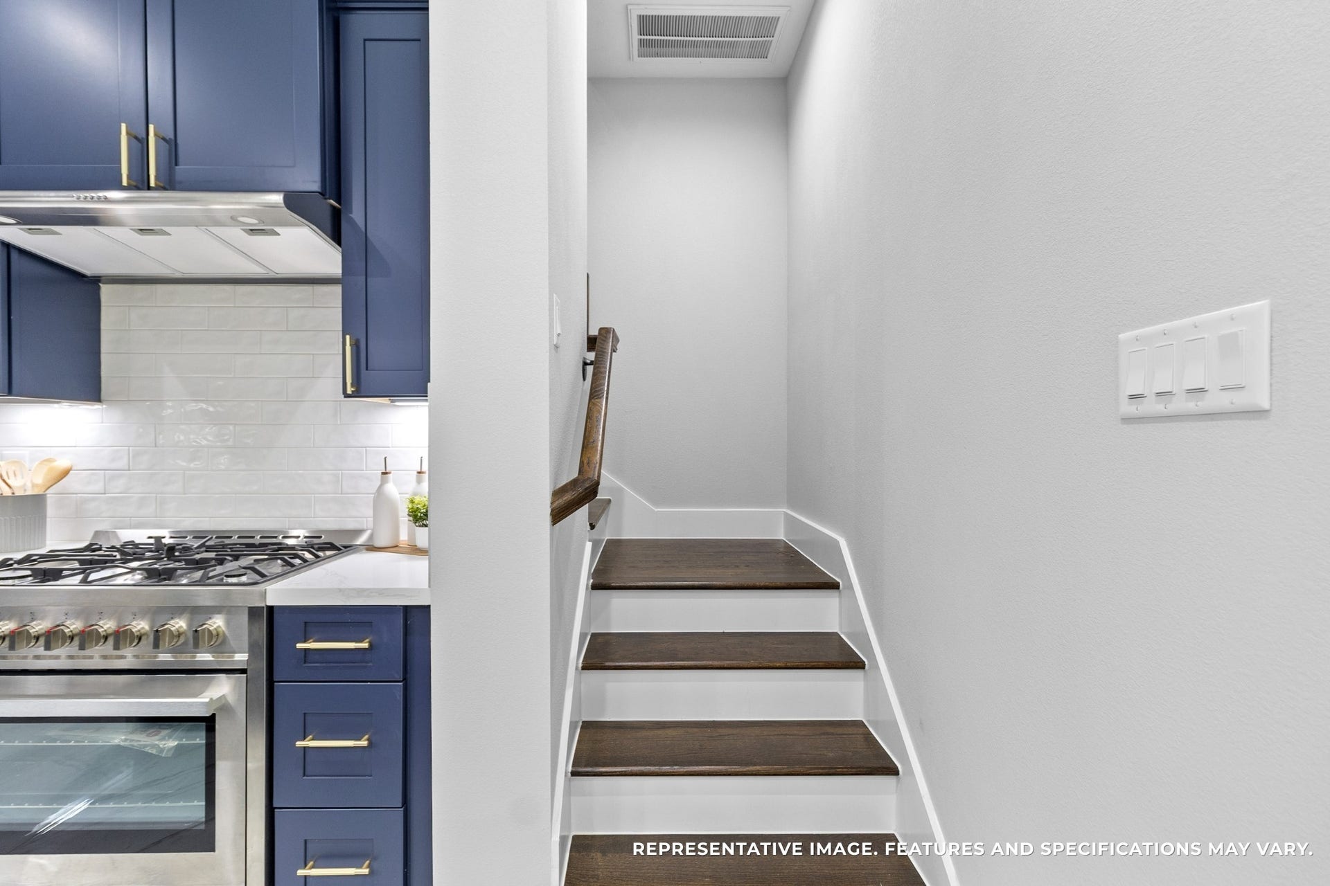 825 Paul Quinn Street, #B, Houston, TX 77091 Tucked beside the kitchen, the stairs invite you upstairs after a long day, the dark wood steps contrasting beautifully against the crisp white walls.