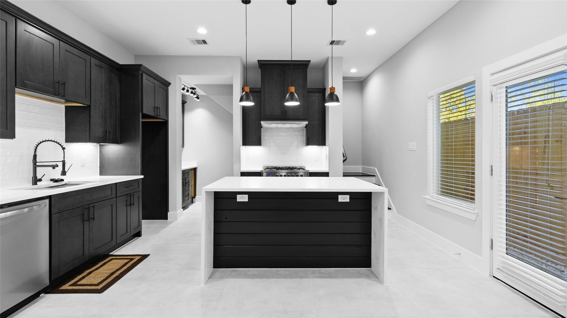 825 Paul Quinn Street, #B, Houston, TX 77091 The kitchen island is where you gather most, whether for a quick breakfast or setting out snacks when friends come by.