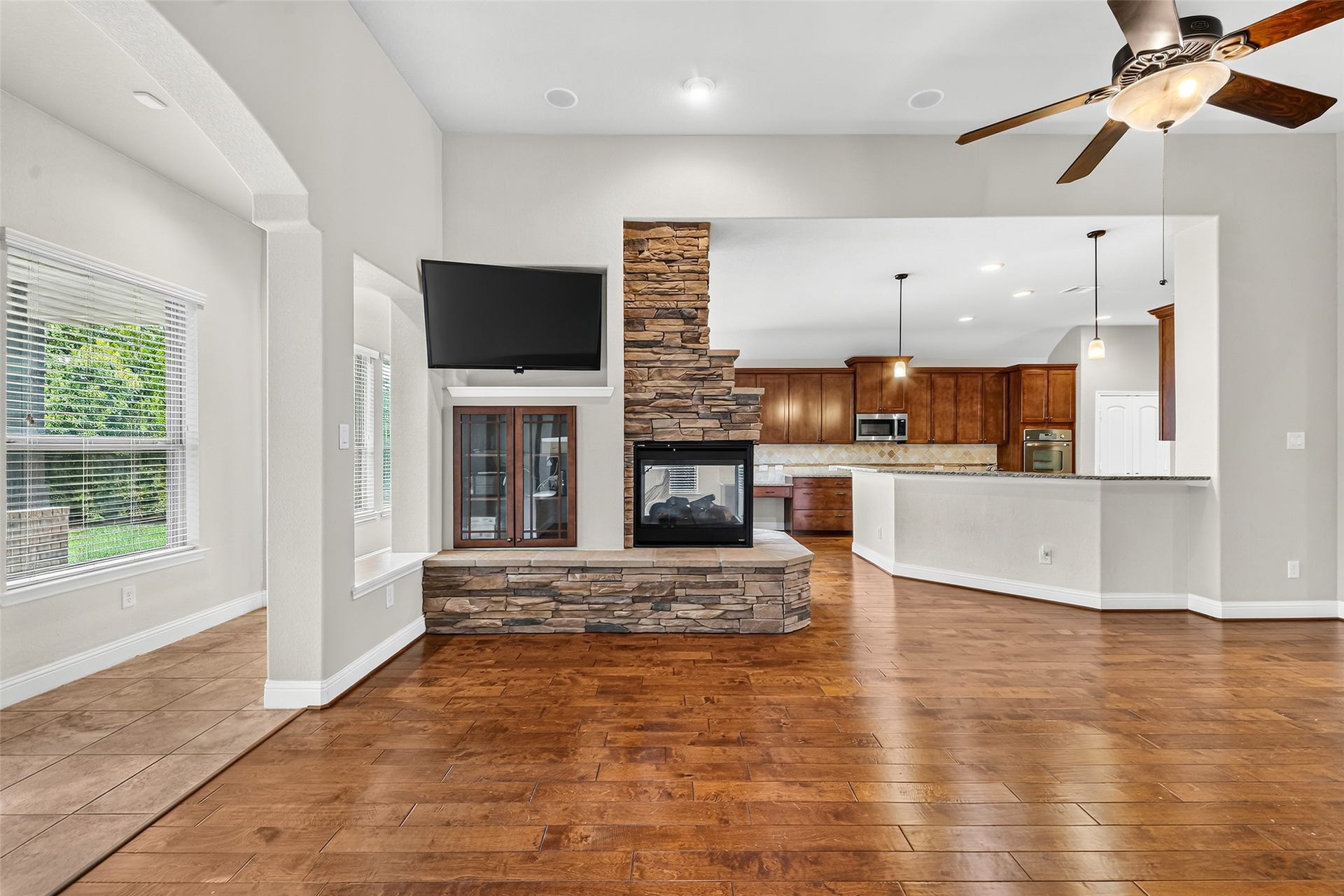 12218 Rampy Green Drive, Tomball, TX 77377 A different perspective of the living area, showcasing the view towards the kitchen and breakfast room.