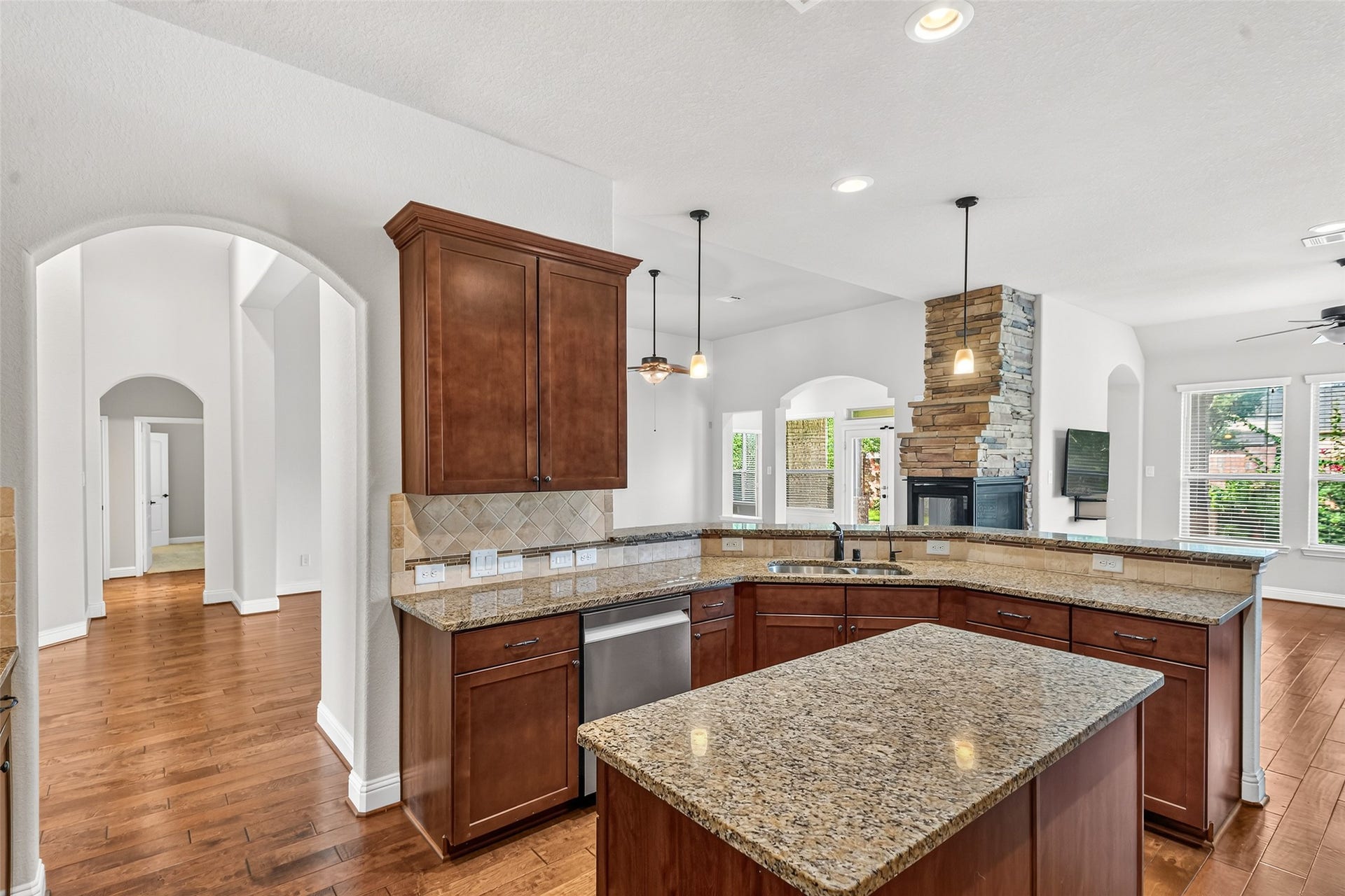 12218 Rampy Green Drive, Tomball, TX 77377 Granite countertops and an island provide extra workspace.