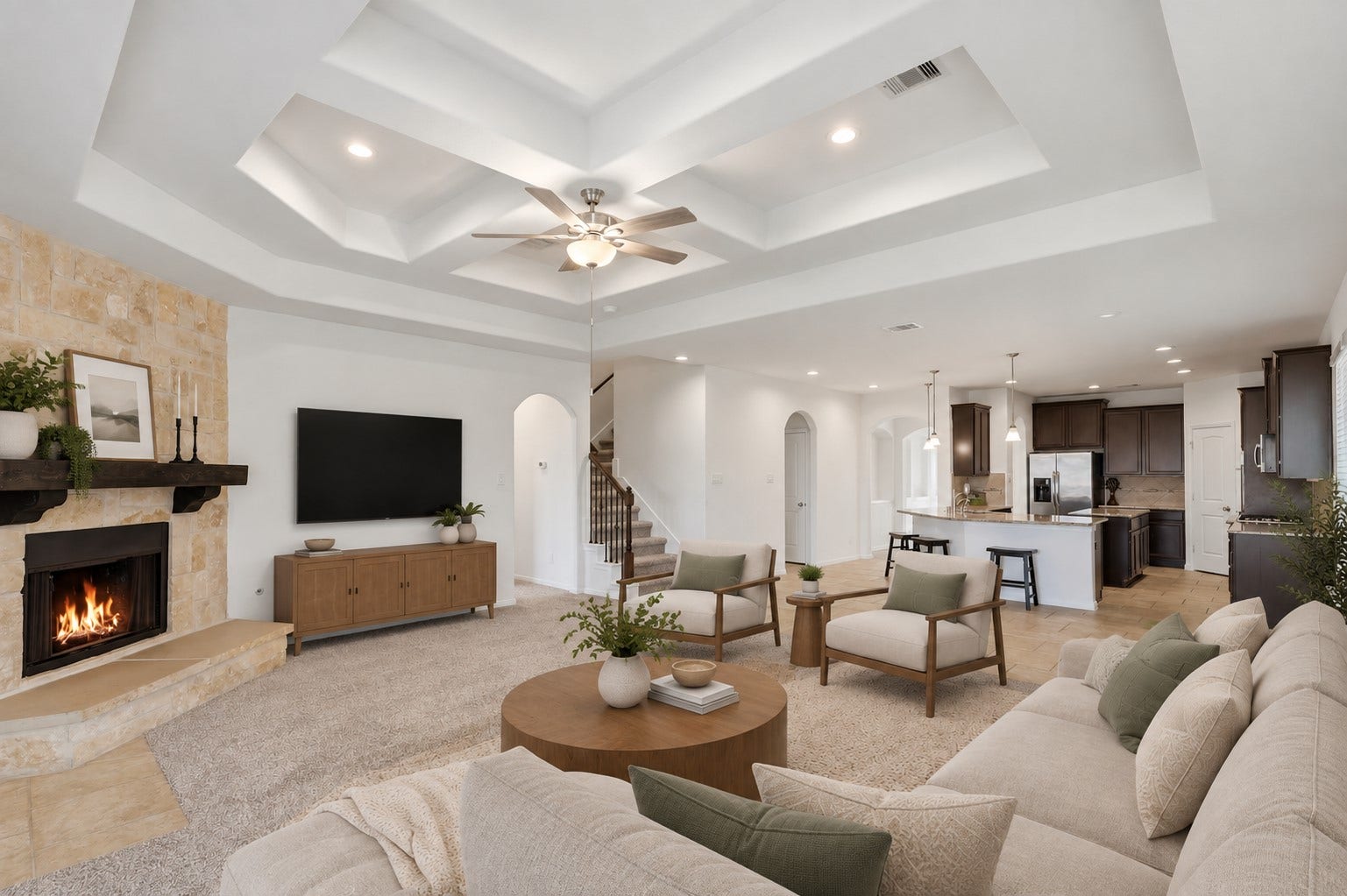 11723 Giovanni Lane, Richmond, TX 77406 A Wonderful Space to Gather, Relax & Entertain! This spacious family room showcases soaring custom ceilings with beautiful recessed detailing, a ceiling fan, and a stunning stone fireplace that creates a warm focal point. The open view toward the kitchen makes it easy to stay connected while cooking, dining, or relaxing. A wall of windows fills the room with natural light and looks out toward the private backyard. *Photo is virtually staged*