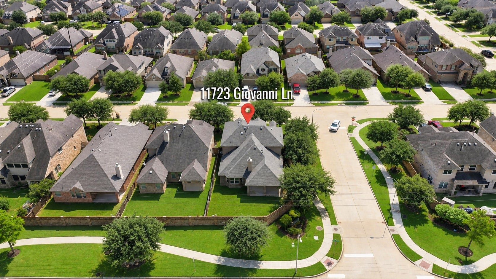 11723 Giovanni Lane, Richmond, TX 77406 A Fantastic View of the Home & Its Corner-Lot Setting! This aerial perspective gives you a great look at the home's generous corner lot, attractive landscaping, private backyard, and surrounding neighborhood. The wide streets, sidewalks, mature trees, and beautifully maintained homes create a welcoming community atmosphere.