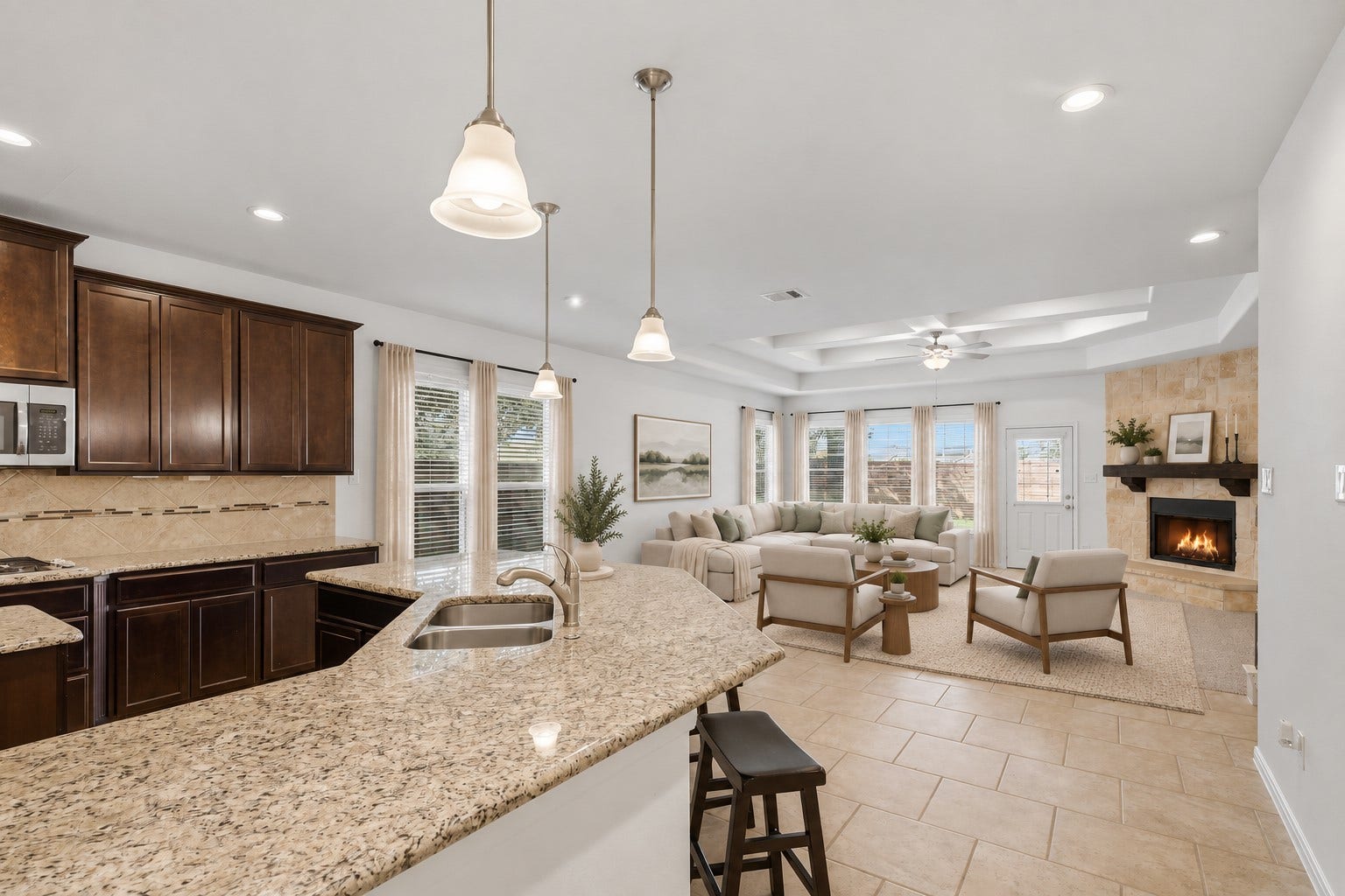 11723 Giovanni Lane, Richmond, TX 77406 The Heart of the Home! This spacious open-concept kitchen flows beautifully into the family room, creating the perfect gathering space. The large island, granite countertops, custom cabinetry, pendant lighting, and stainless steel appliances make this kitchen as beautiful as it is practical. And I especially love how easily everyone can stay connected while cooking, dining, and relaxing! *Photo is virtually staged*