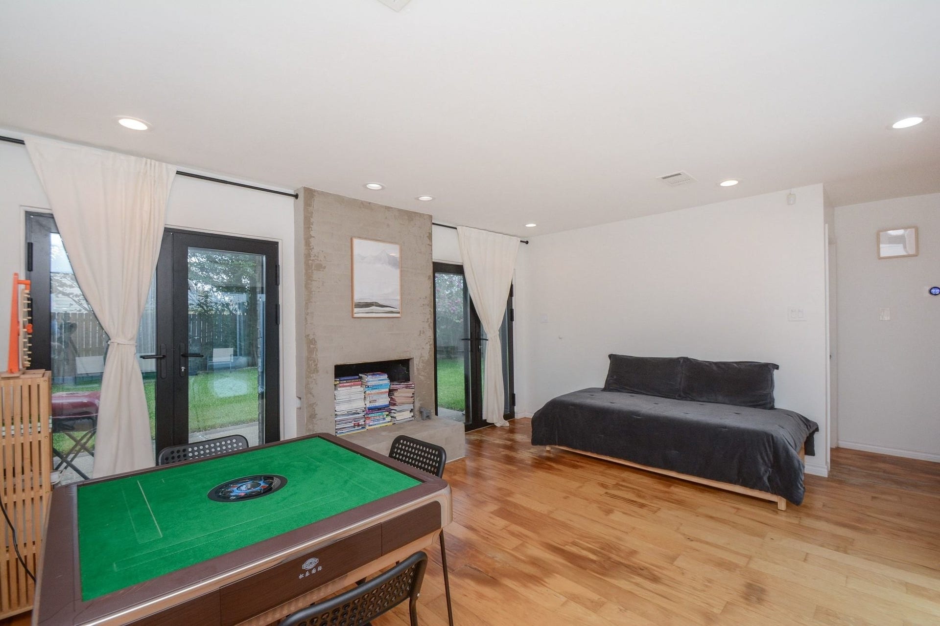 Large versatile living space featuring modern finishes, recessed lighting, and generous natural light.