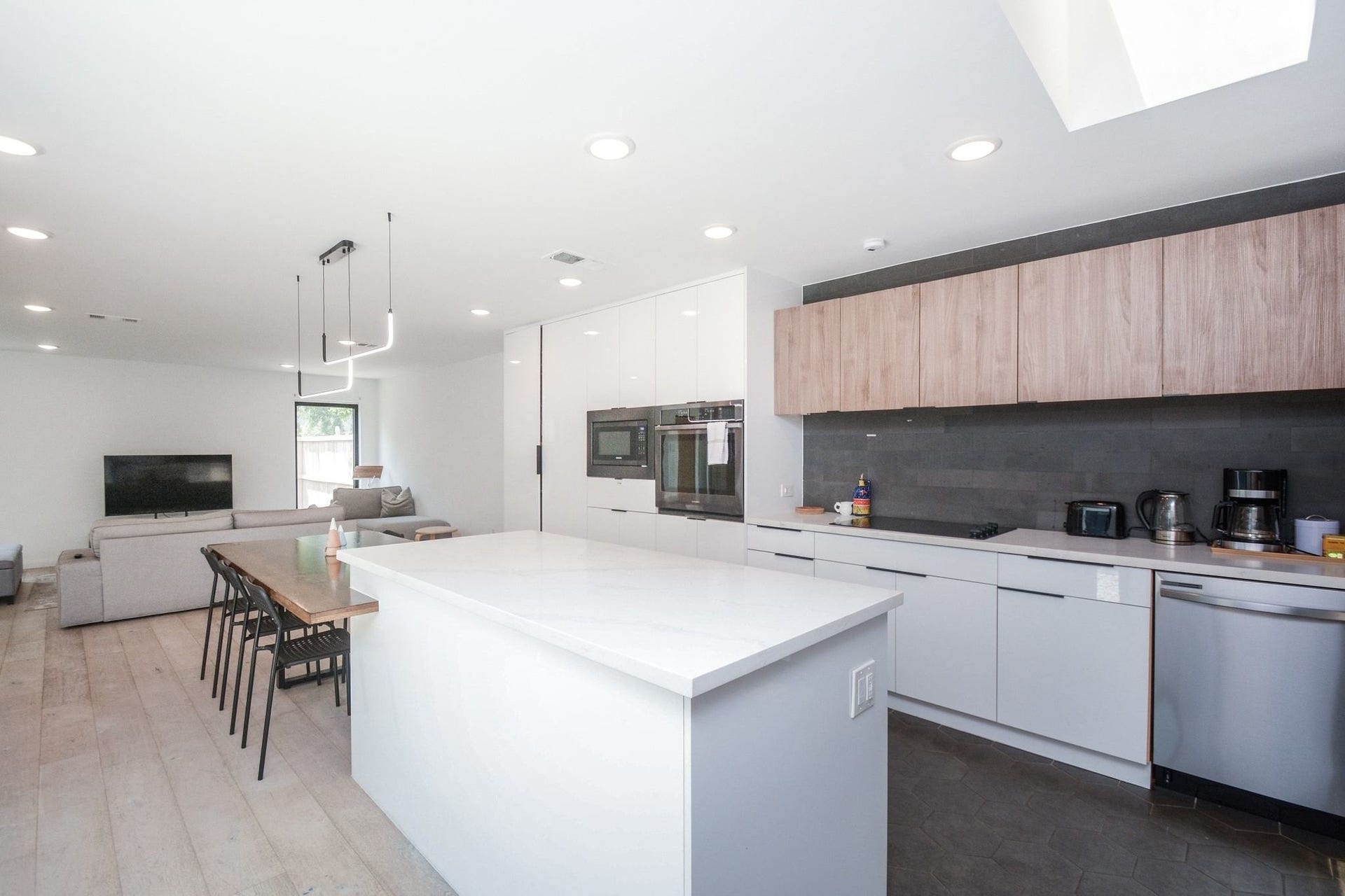 Bright open-concept kitchen and dining area with contemporary finishes and abundant natural light.