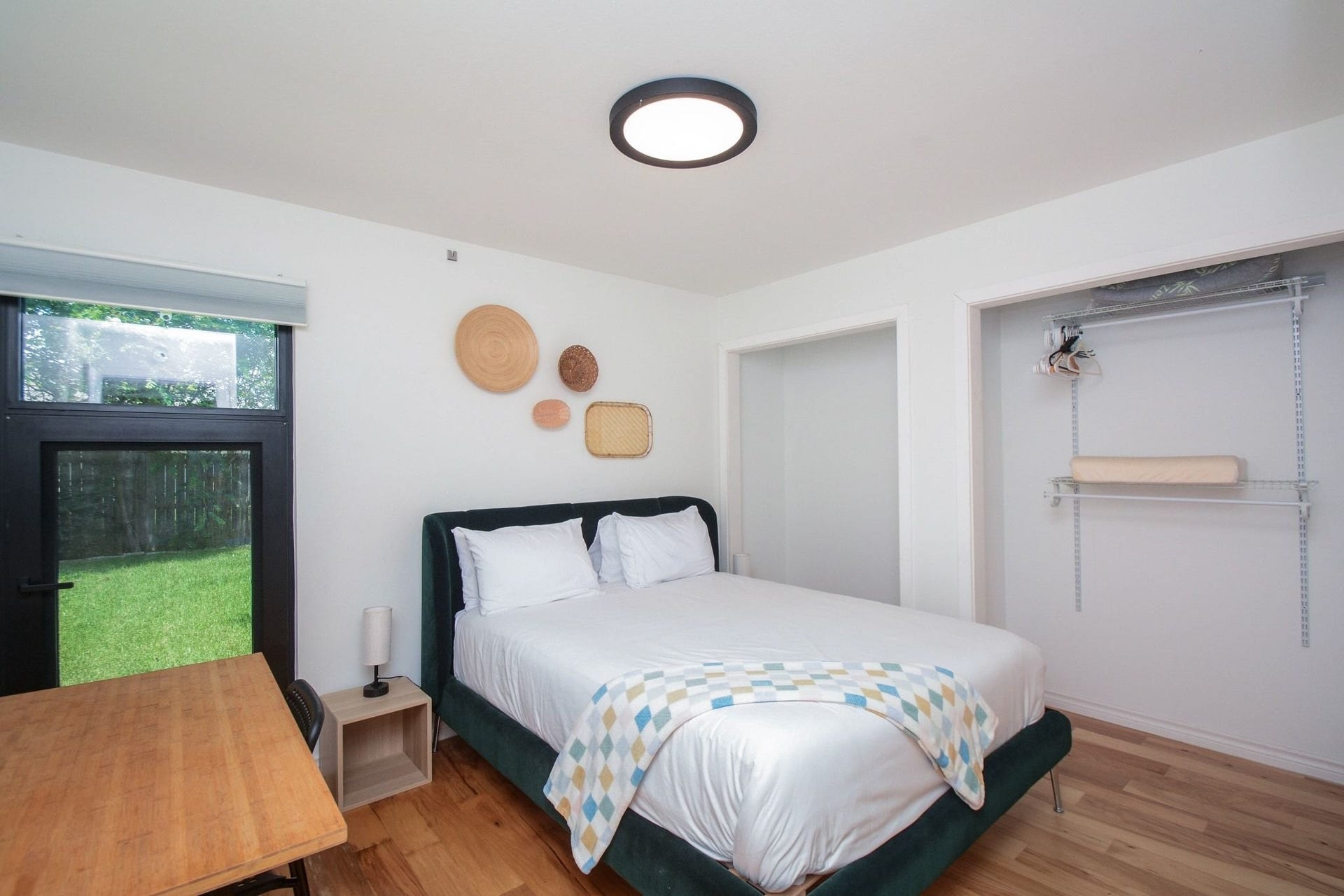 Spacious bedroom featuring modern finishes, ceiling fan, and abundant natural light.
