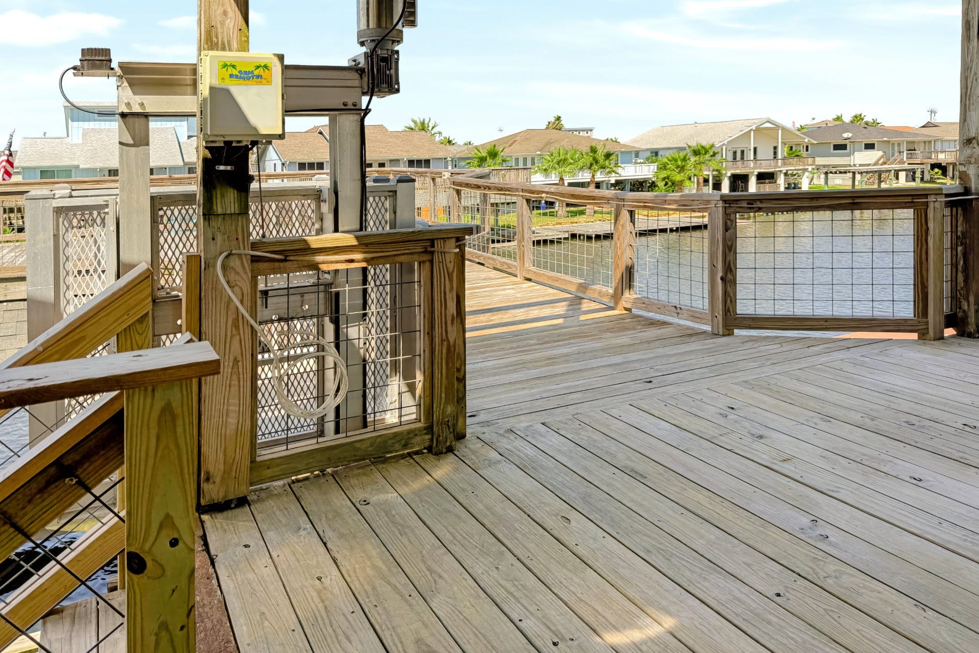 1144 Sailfish Street, Bayou Vista, TX 77563 ANOTHER VIEW OF BACK STAIRS LANDING AND CARGO LIFT AND CAT WALK OUT TO DECK OVER BOAT HOUSE