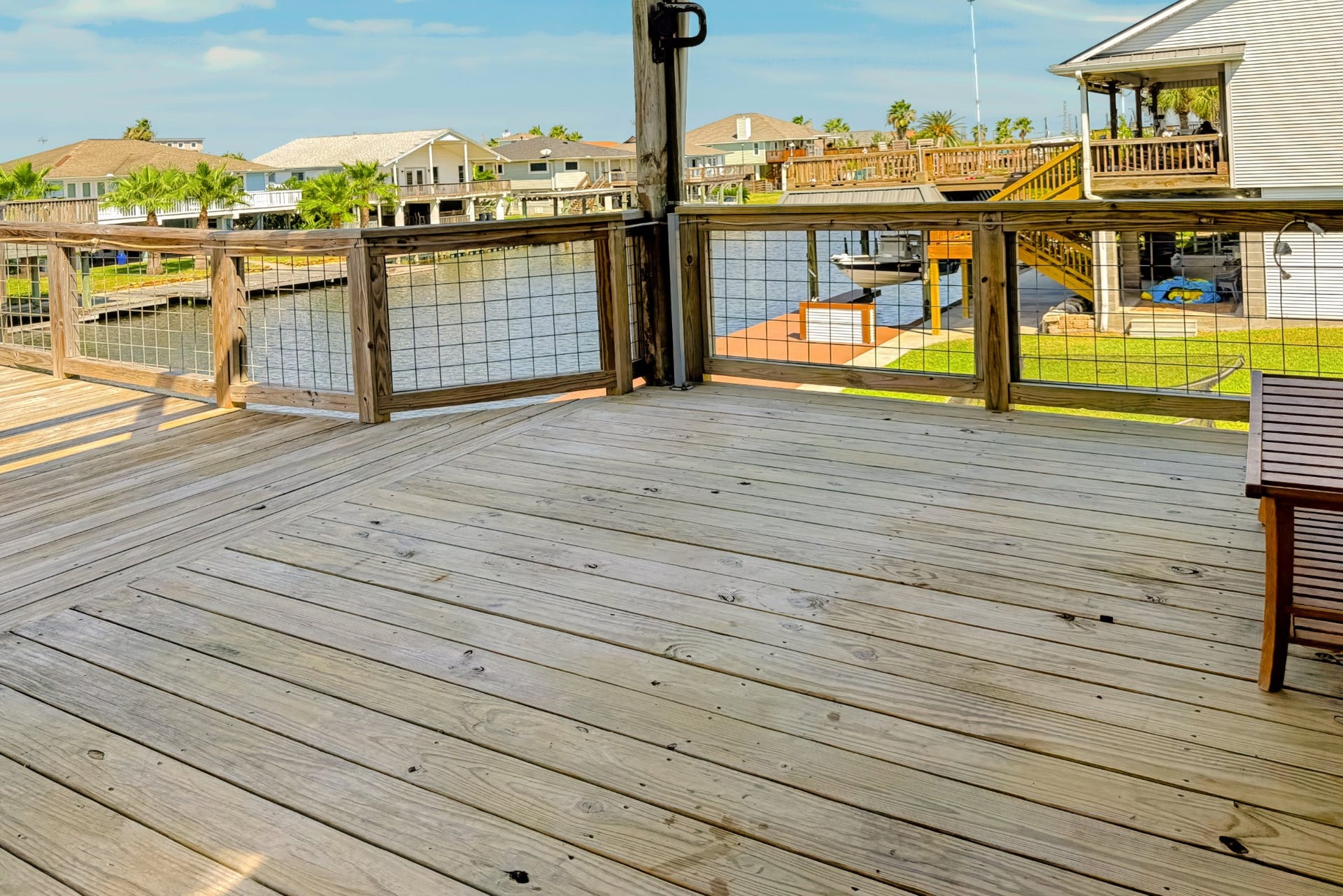 1144 Sailfish Street, Bayou Vista, TX 77563 COVERED BACK DECK AREA AT BACK DOOR OF HOUSE, GREAT AREA TO SIT AND WATCH THE BOATS GO BY