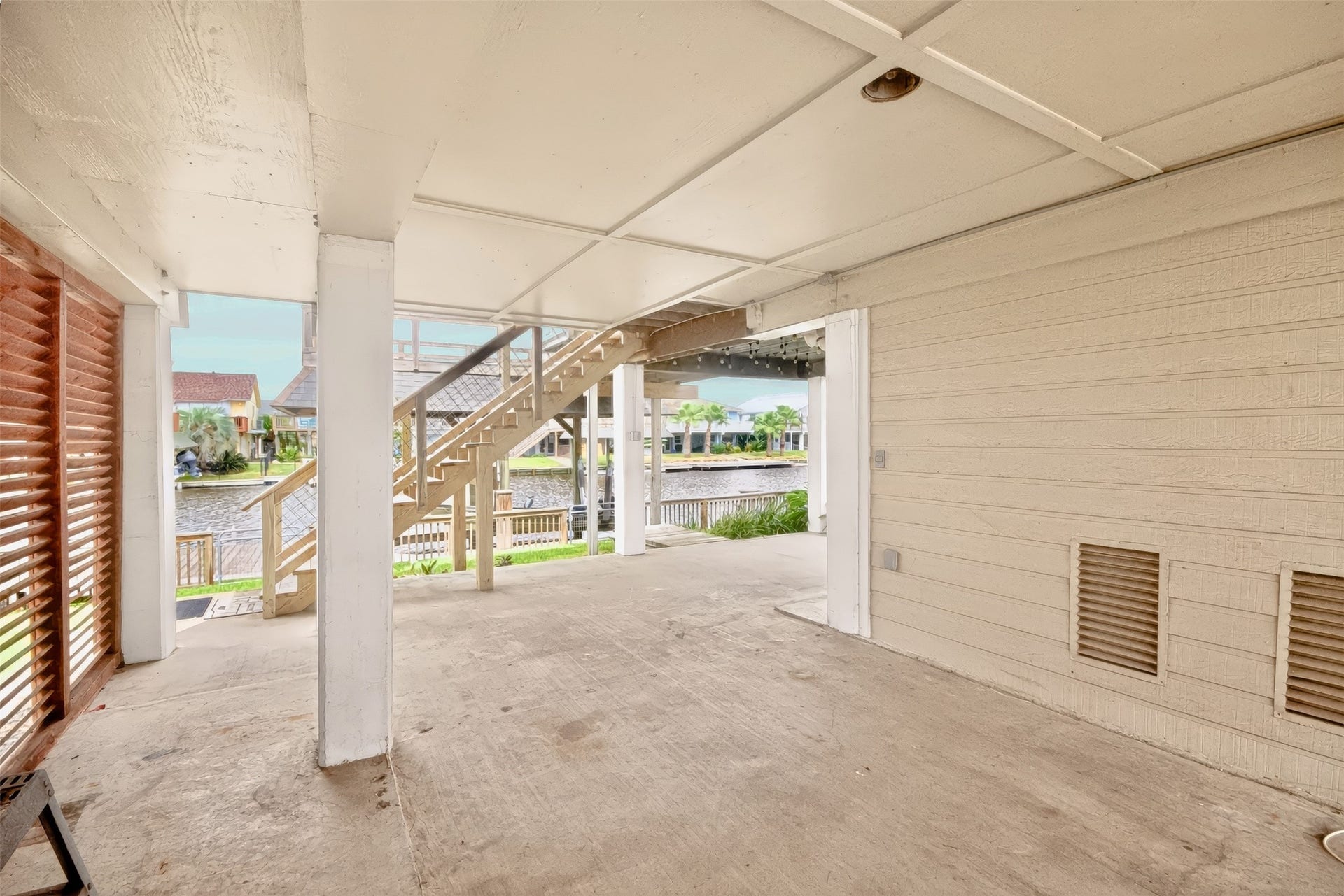 1144 Sailfish Street, Bayou Vista, TX 77563 AMAZING AREA UNDER HOUSE WITH SHADE FOR ENTERTAINING GUESTS OR CAN STORING YOUR TOYS HERE