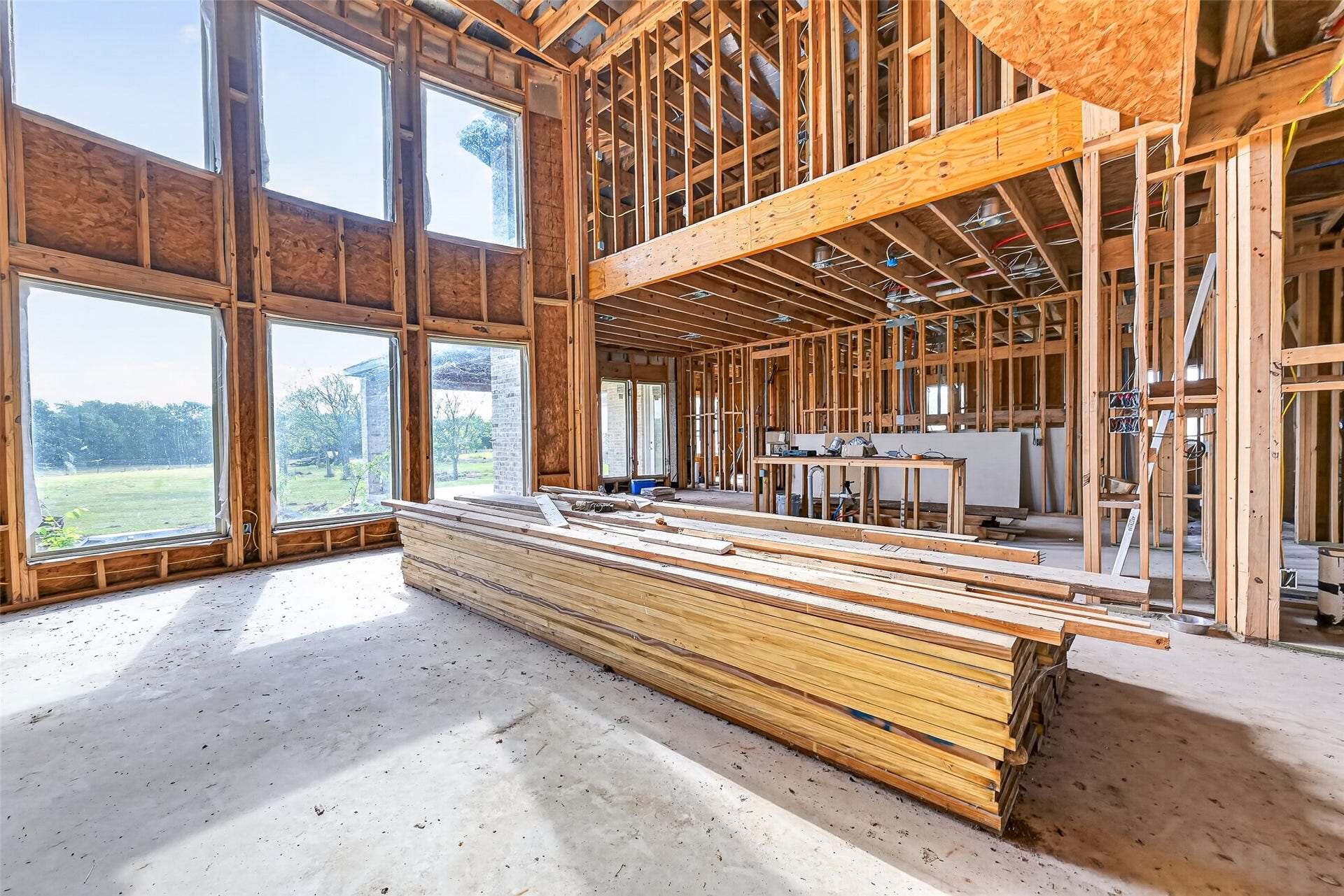 8023 Pool Hill Road, Fulshear, TX 77441 Open unfinished space showcasing framing and build progress.