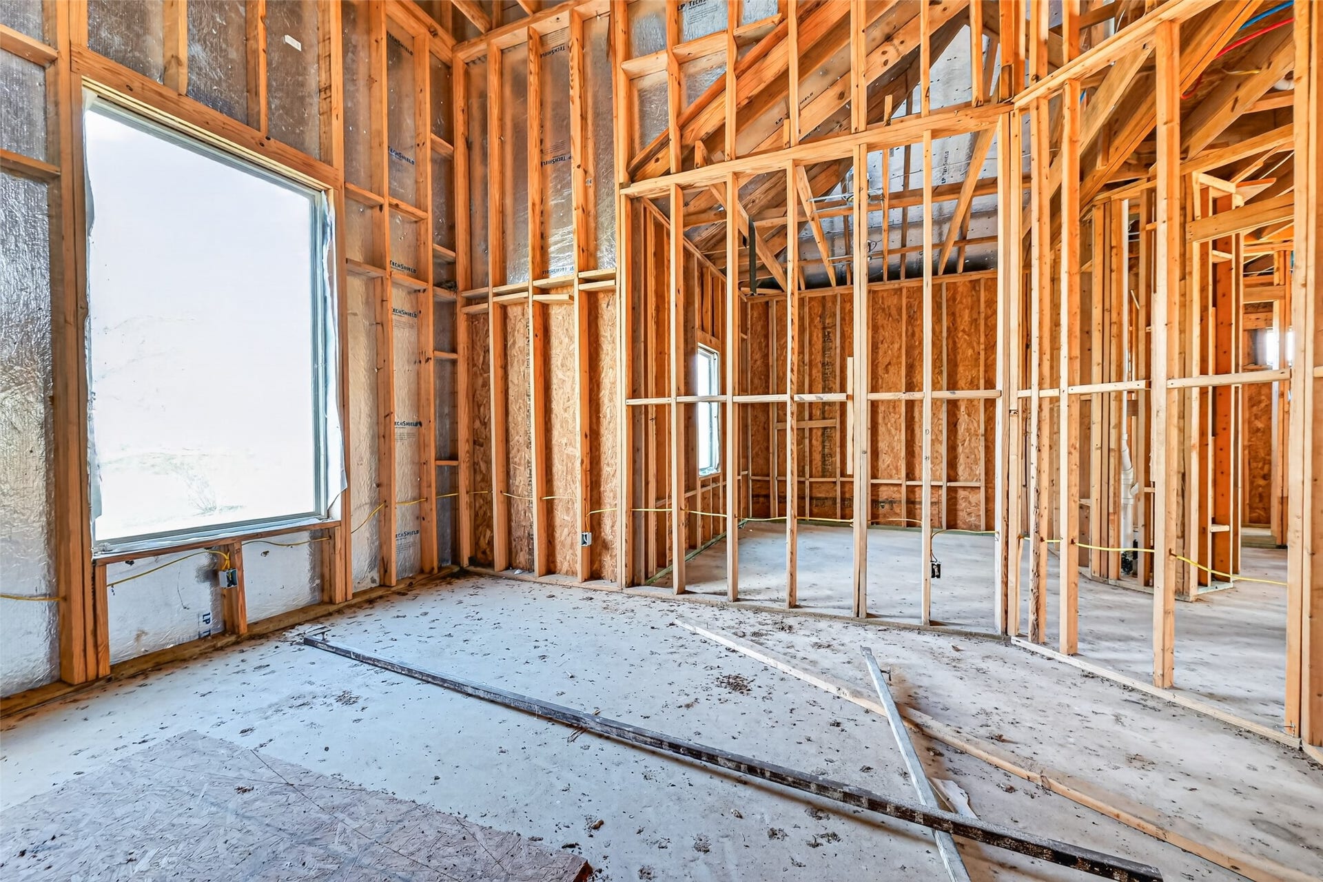 8023 Pool Hill Road, Fulshear, TX 77441 Open unfinished space showcasing framing and build progress.