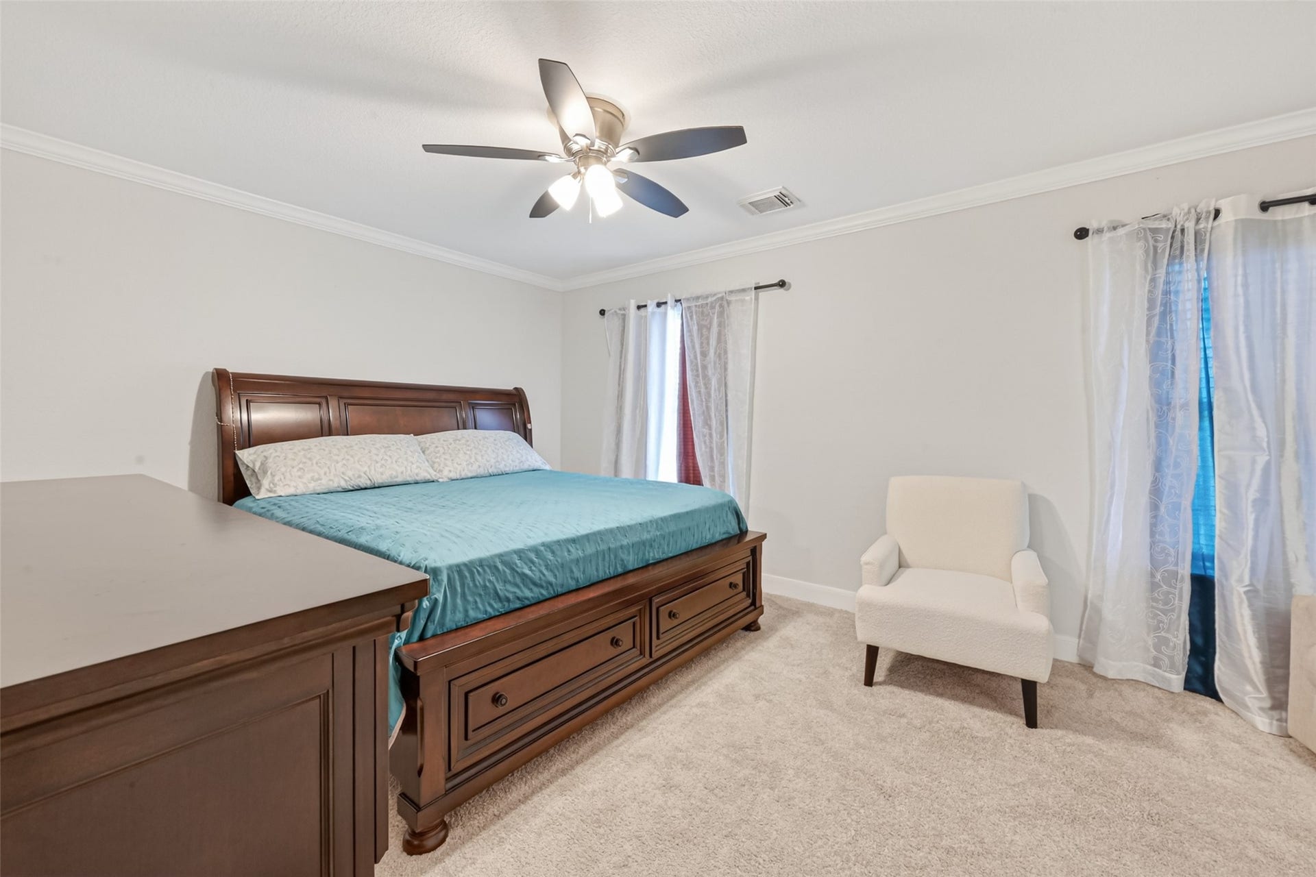8023 Pool Hill Road, Fulshear, TX 77441 Second-level bedroom with generous proportions, ceiling fan, and natural light.