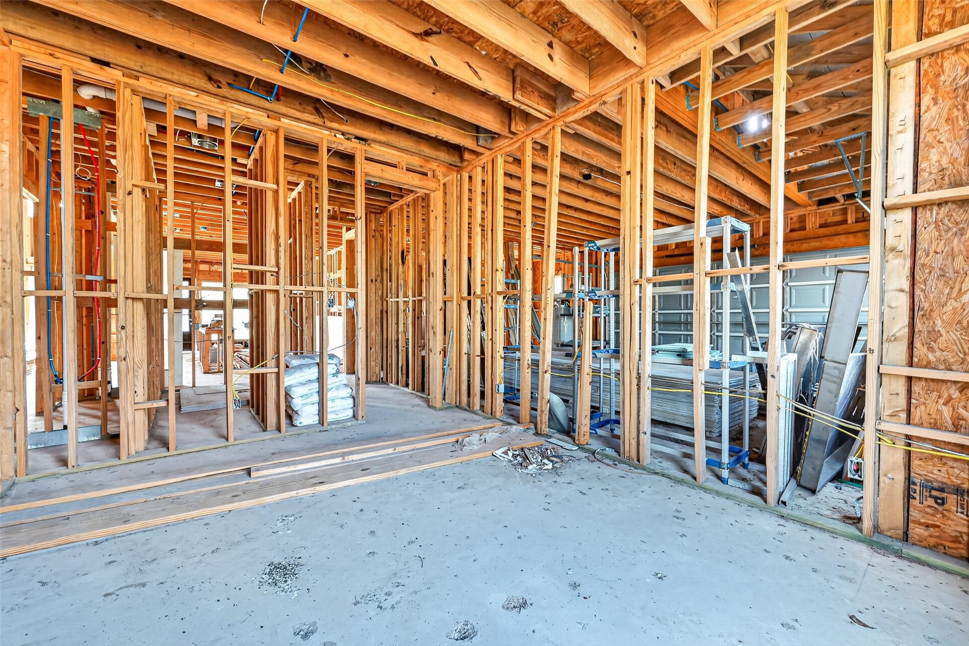 8023 Pool Hill Road, Fulshear, TX 77441 Open unfinished space showcasing framing and build progress.