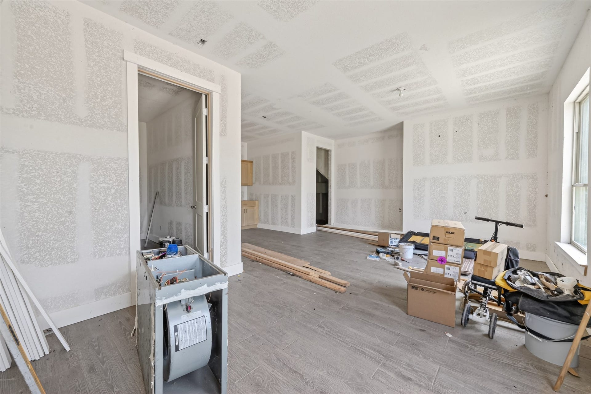 8023 Pool Hill Road, Fulshear, TX 77441 Main-level interior featuring unfinished drywall, open layout, and construction in progress.