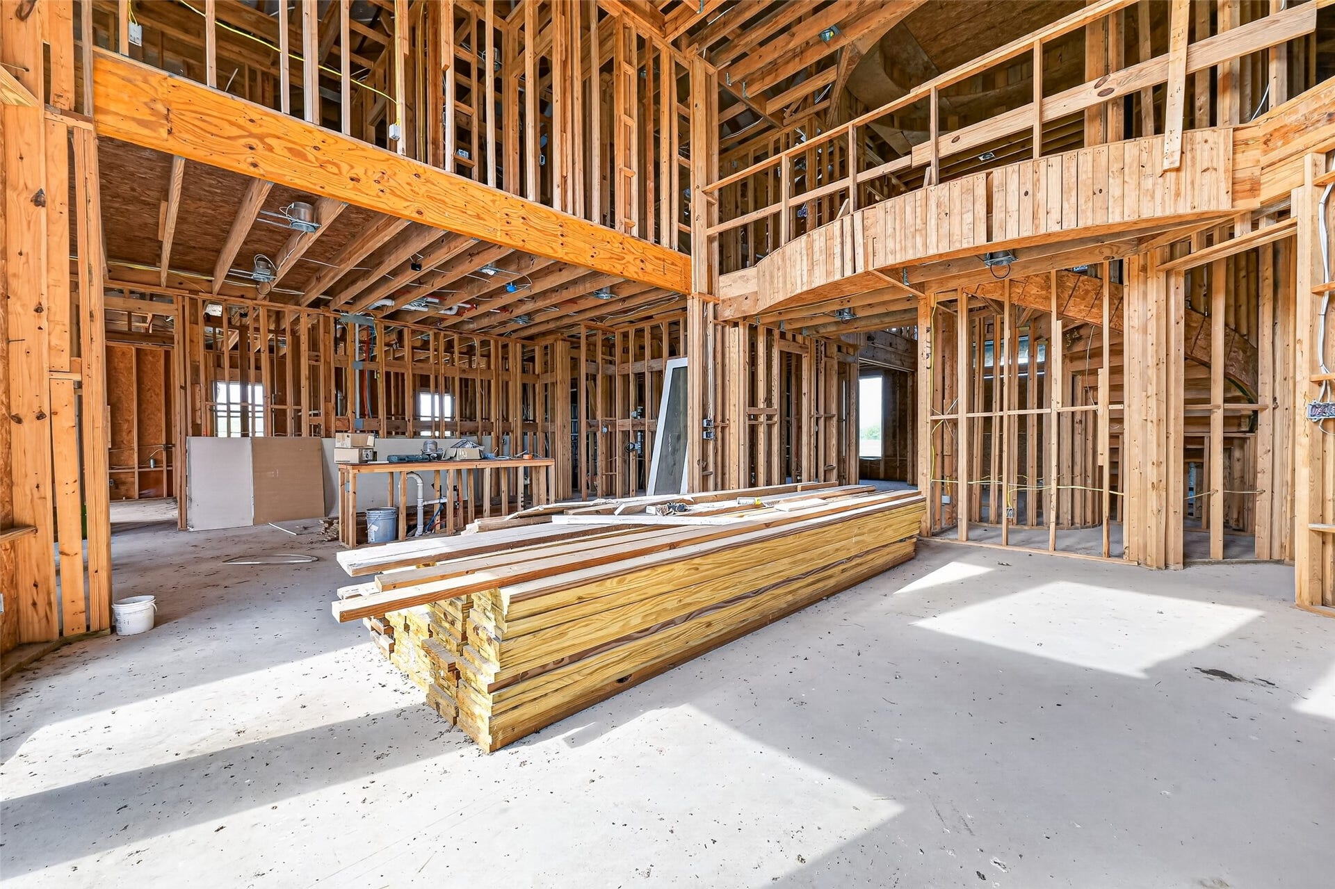 8023 Pool Hill Road, Fulshear, TX 77441 Open unfinished space showcasing framing and build progress.
