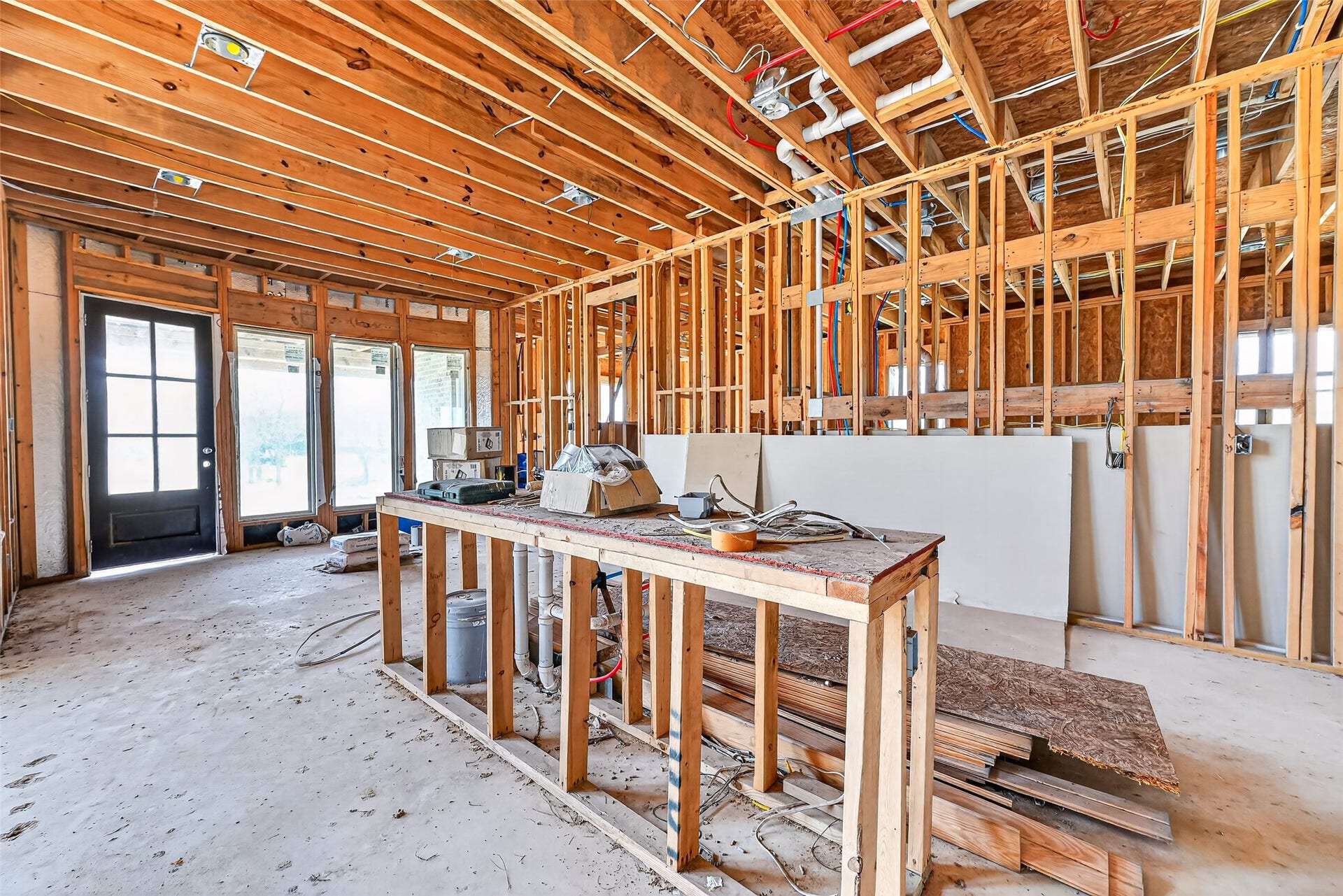 8023 Pool Hill Road, Fulshear, TX 77441 Open unfinished space showcasing framing and build progress.