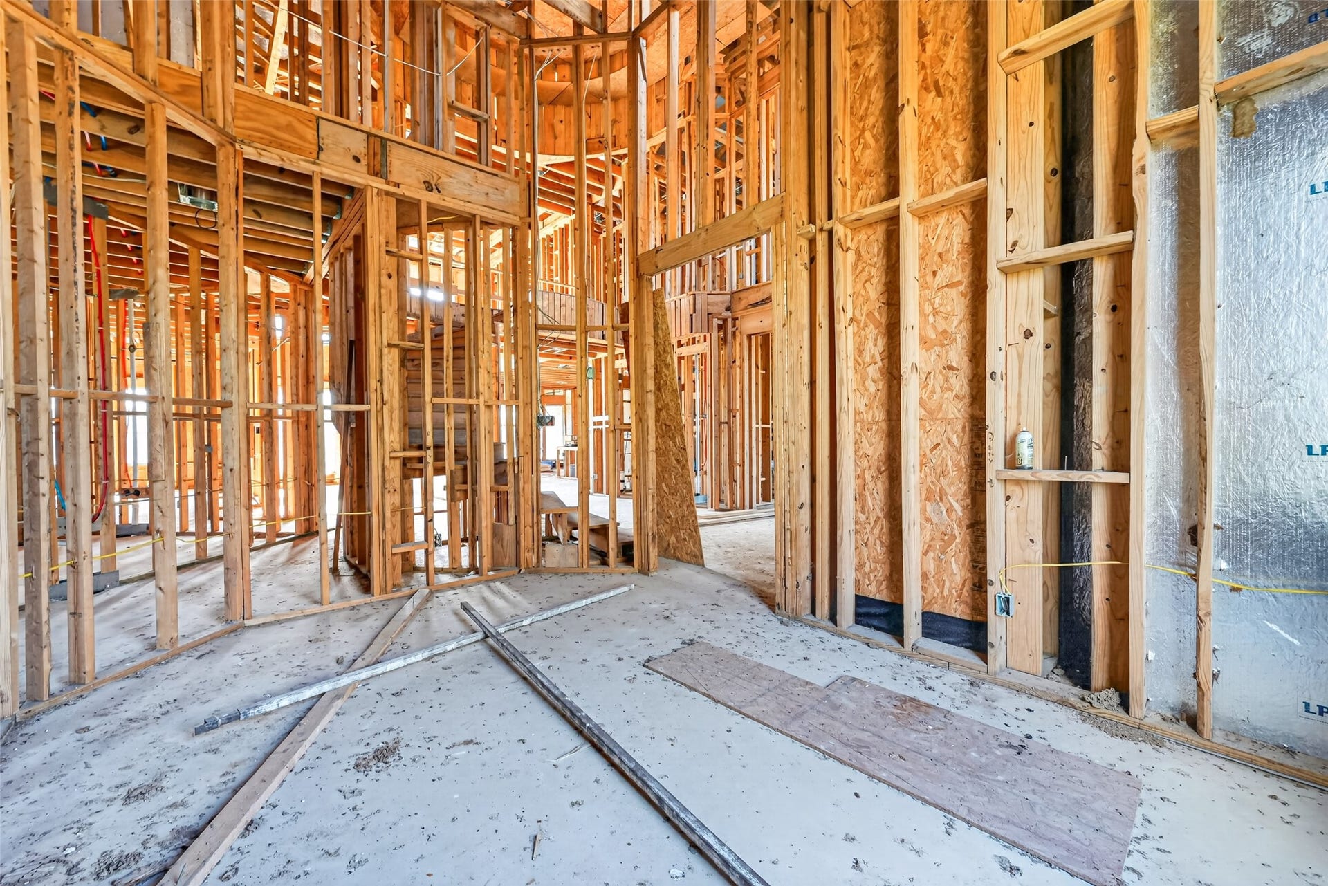 8023 Pool Hill Road, Fulshear, TX 77441 Open unfinished space showcasing framing and build progress.