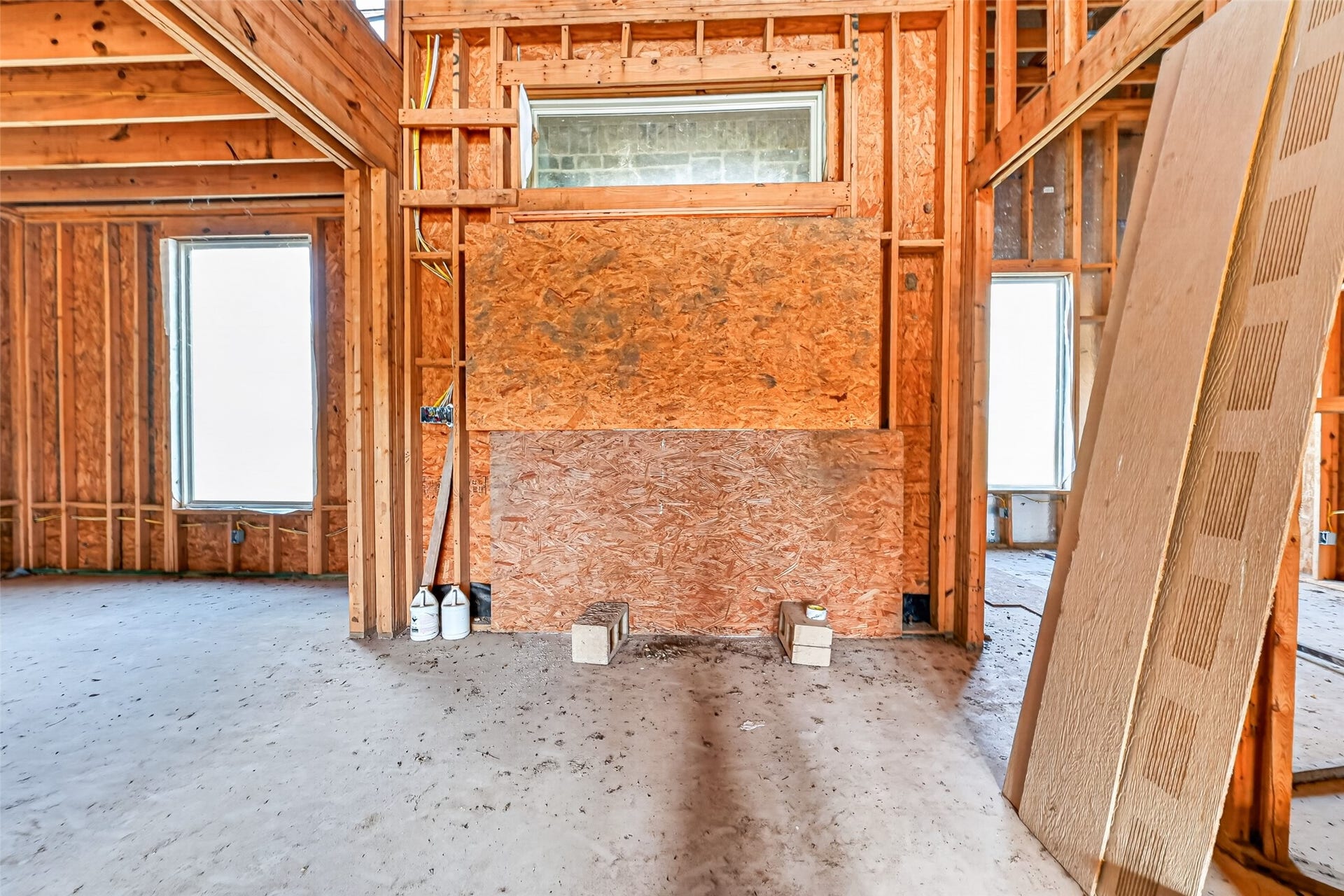 8023 Pool Hill Road, Fulshear, TX 77441 Open unfinished space showcasing framing and build progress.