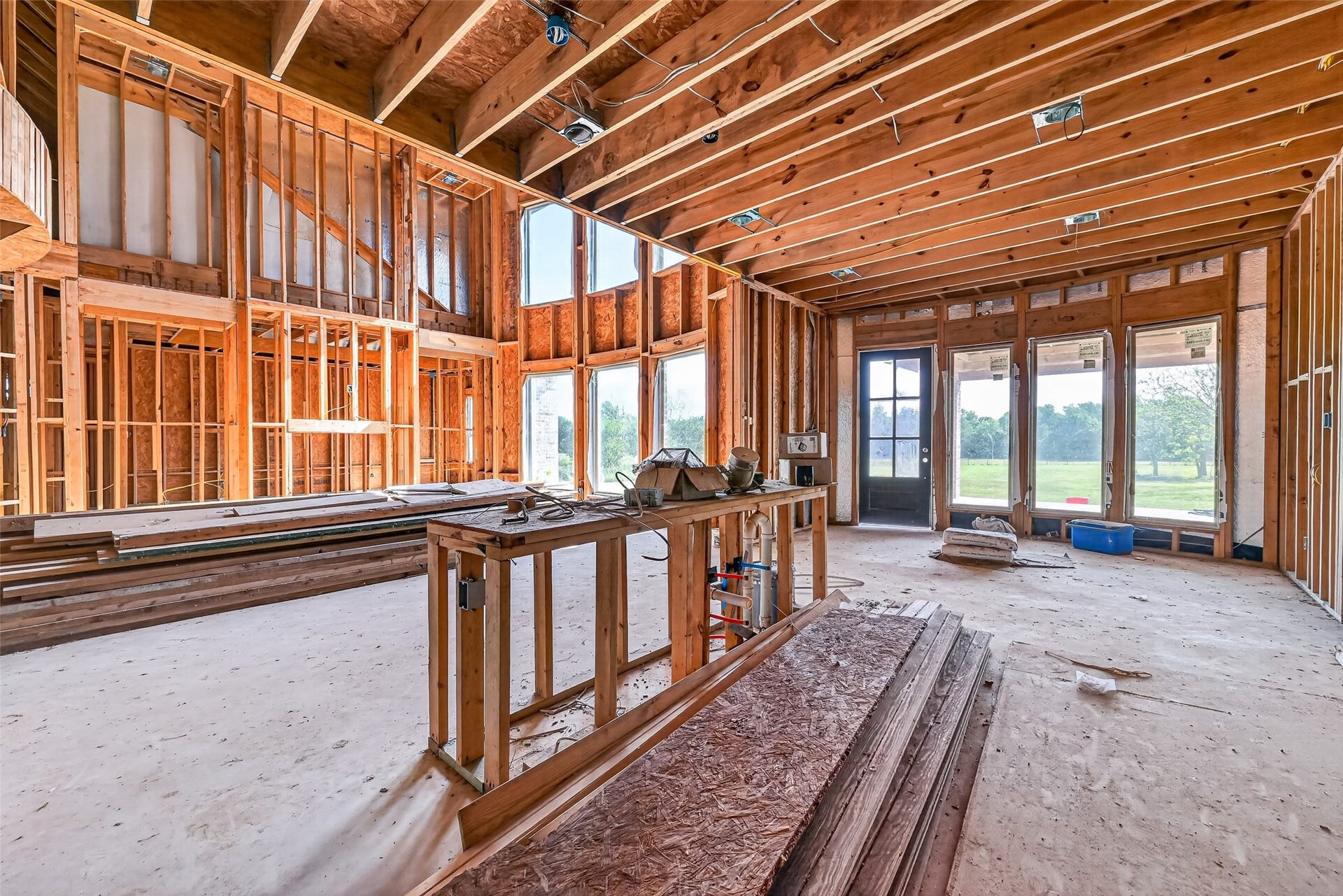 8023 Pool Hill Road, Fulshear, TX 77441 Open unfinished space showcasing framing and build progress.