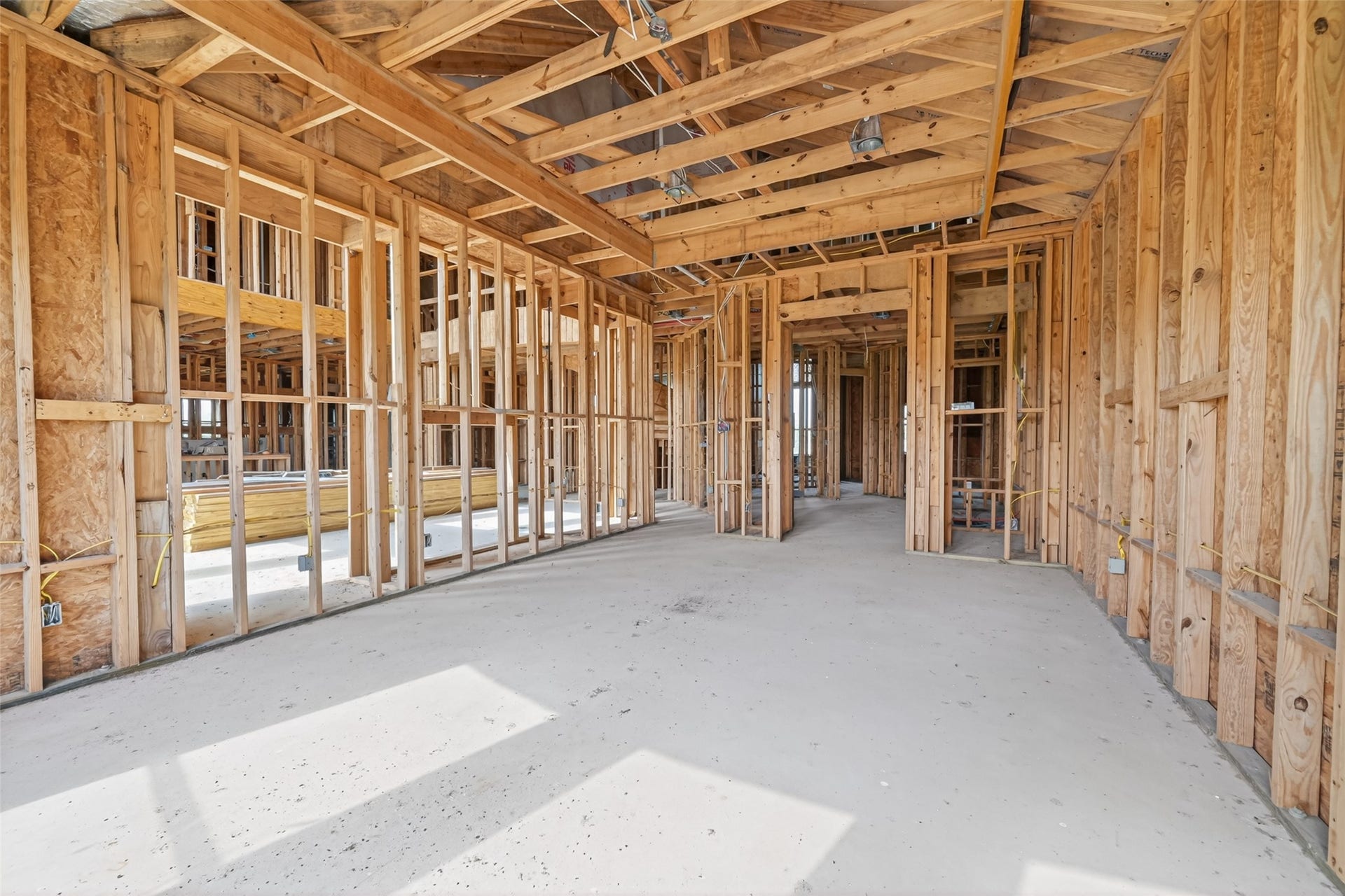 8023 Pool Hill Road, Fulshear, TX 77441 Open unfinished space showcasing framing and build progress.