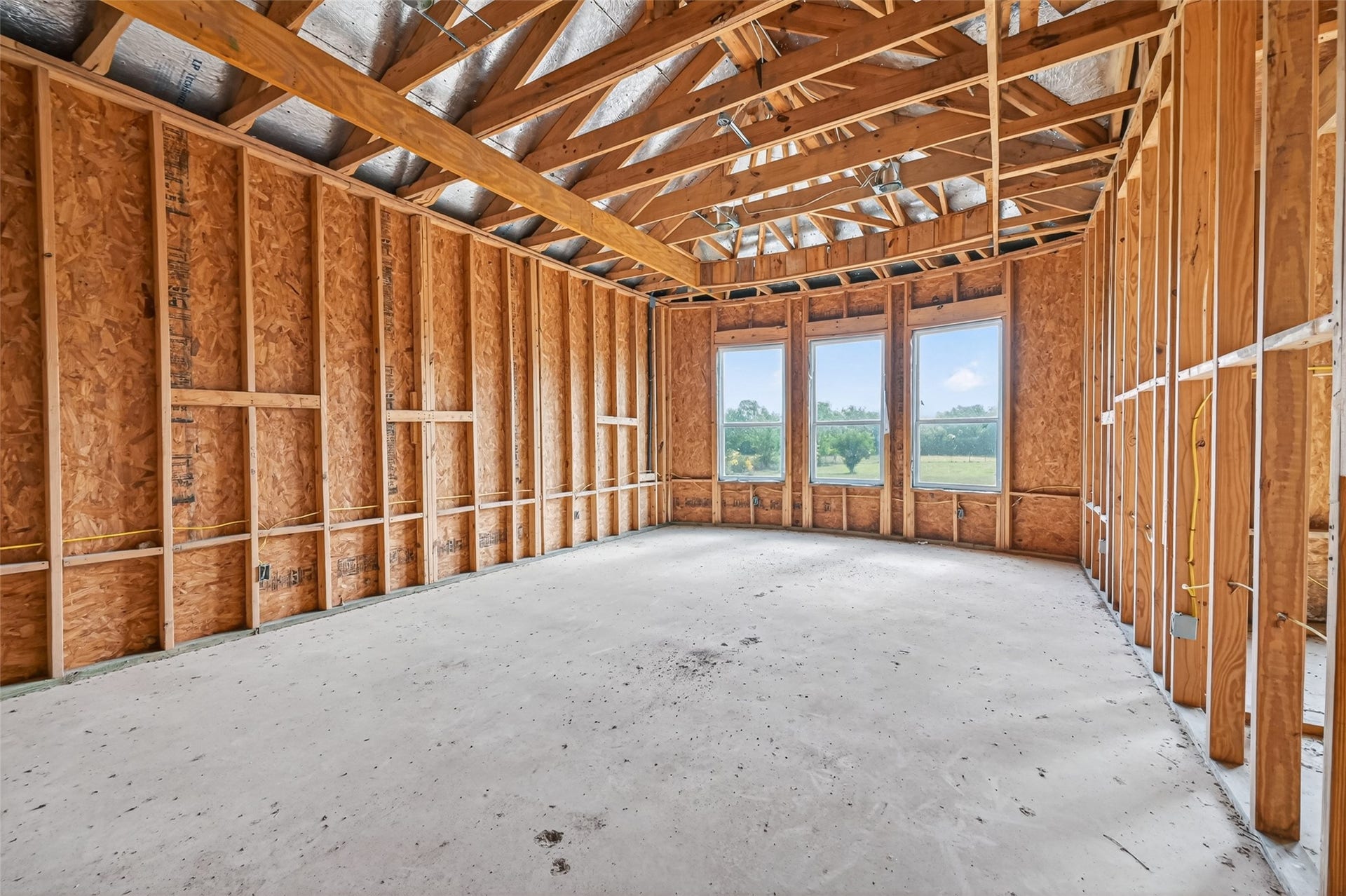 8023 Pool Hill Road, Fulshear, TX 77441 Open unfinished space showcasing framing and build progress.