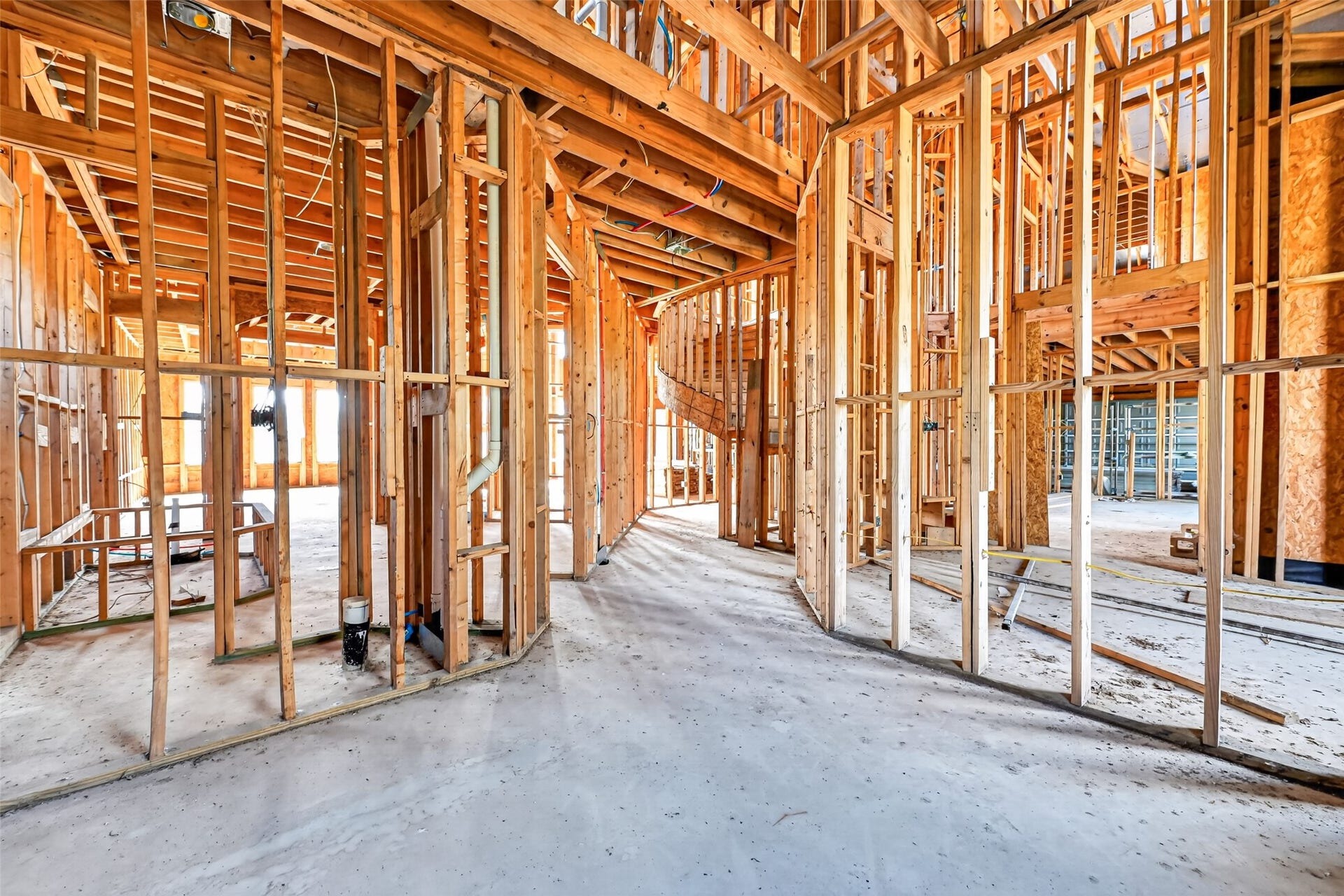 8023 Pool Hill Road, Fulshear, TX 77441 Open unfinished space showcasing framing and build progress.