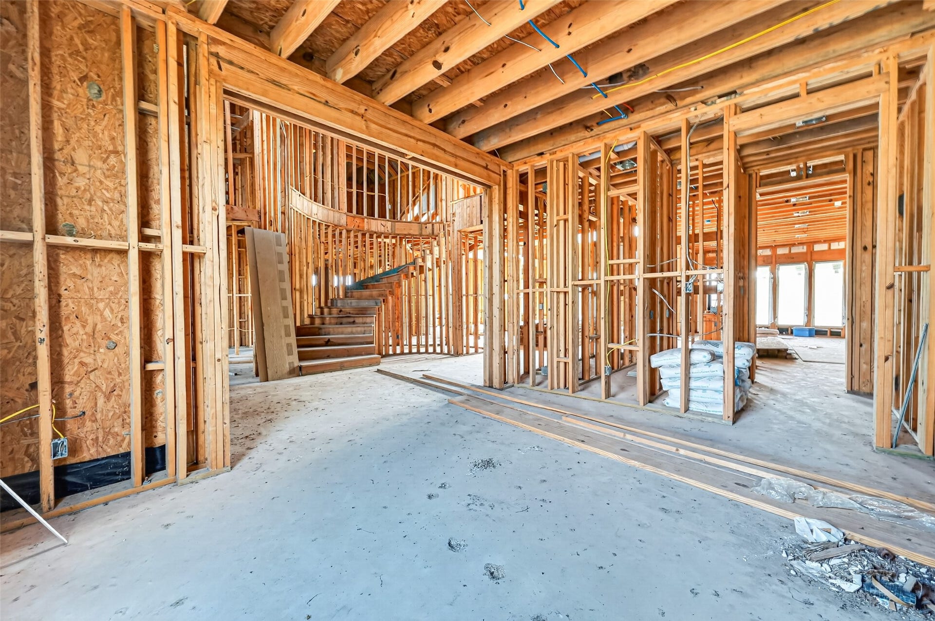 8023 Pool Hill Road, Fulshear, TX 77441 Open unfinished space showcasing framing and build progress.