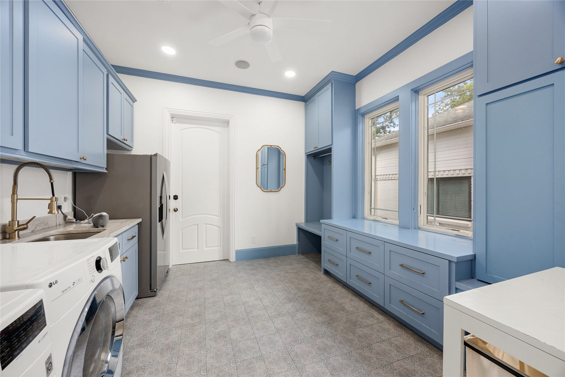 330 E Gaywood Drive, Houston, TX 77079 The huge laundry room has tons of storage and built ins, a sink and room for refrigerator.
