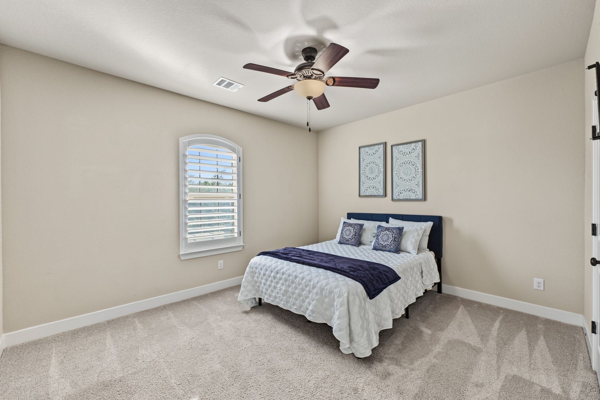 Private Downstairs Secondary Suite! Spacious secondary bedroom featuring its own en-suite bathroom with a granite vanity, beautiful tilework, and a walk-in showerperfect for guests or multigenerational living!